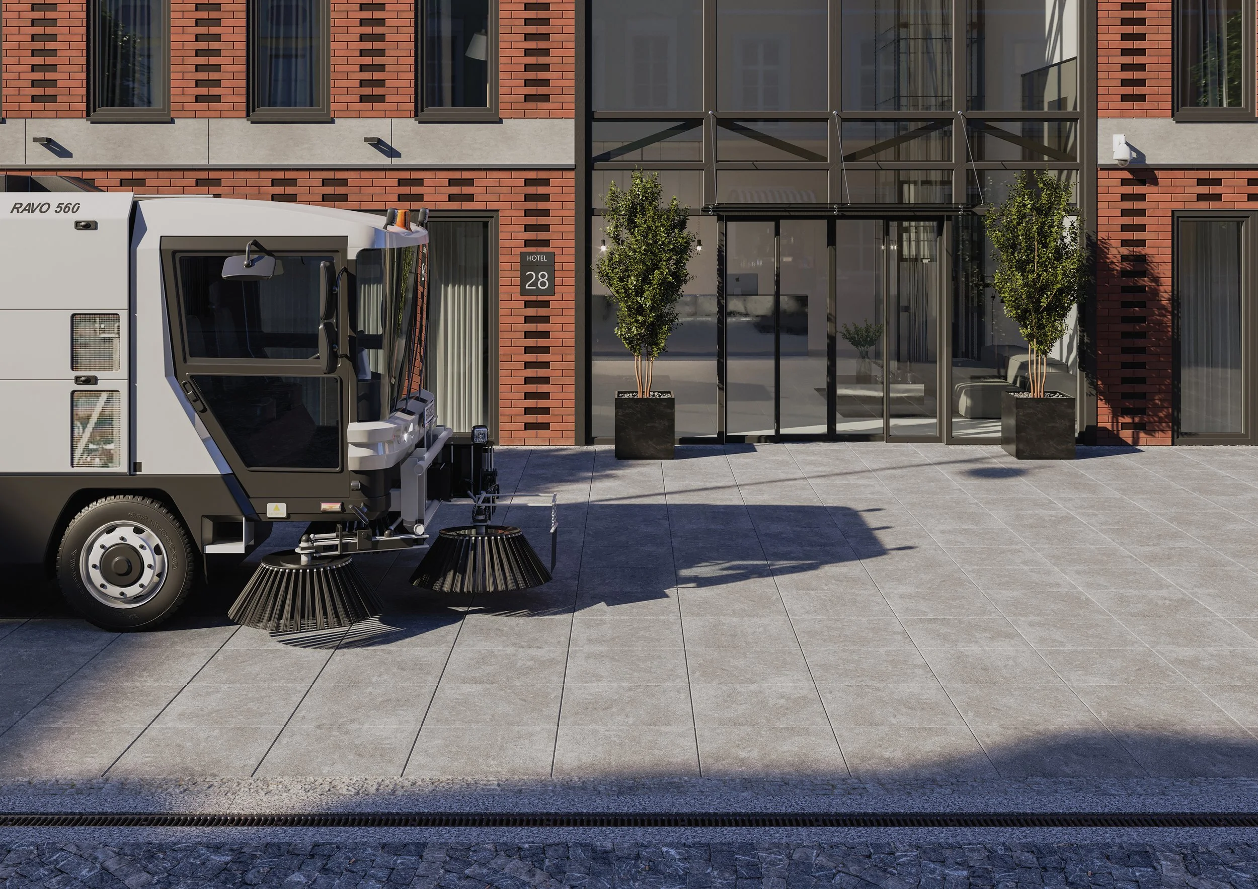 Talo, jonka edessä vihreitä puita istutettuina, ja pieni auto, joka on varustettu kurottimella ja mustilla harjasijoilla.