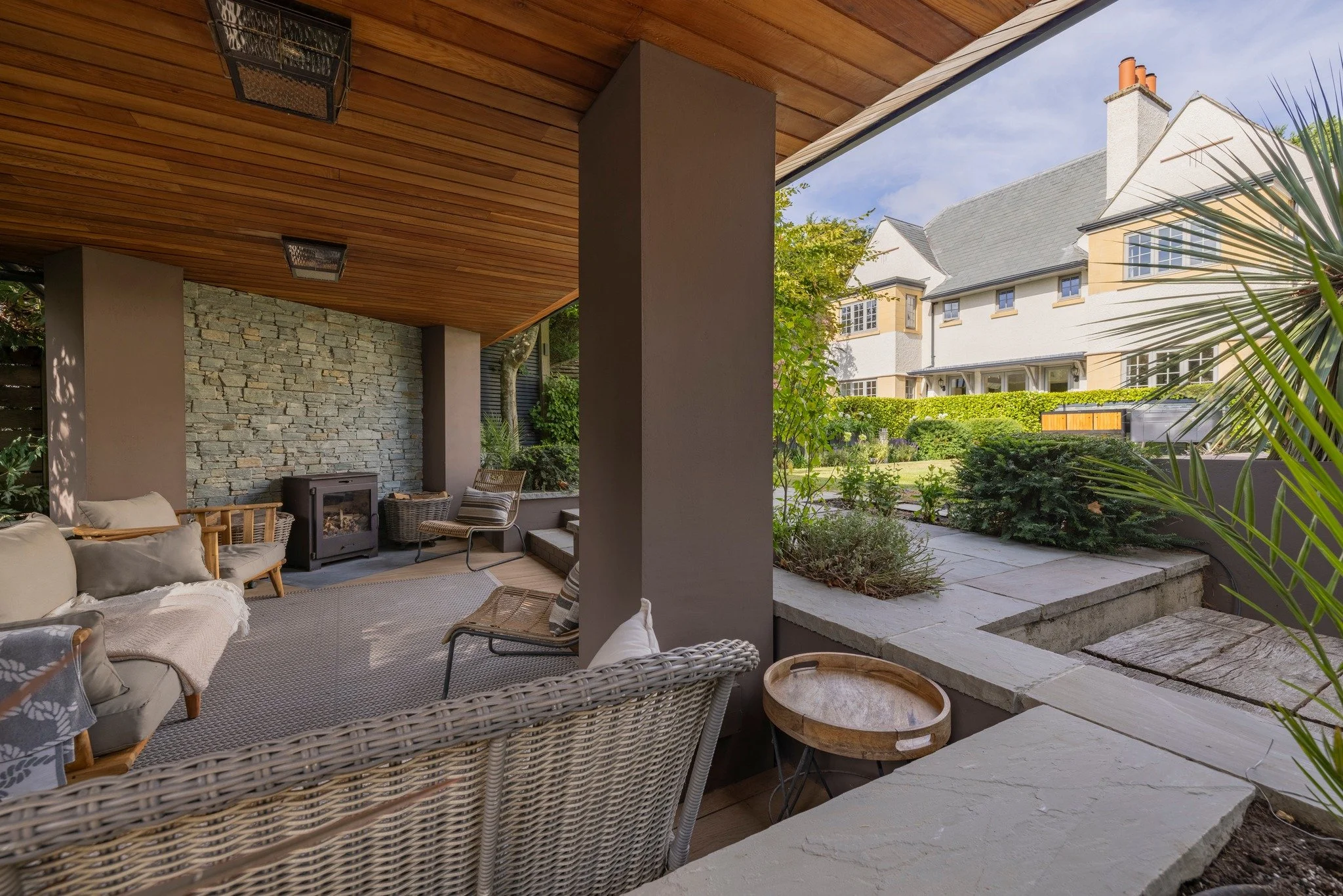 ☀️ Inside-outside living, perfected.

From the natural stone and timber detailing to the poolside deck, this Sussex home blurs the line between indoors and out. Covered seating with a log burner makes it cosy year-round, while landscaped greenery and