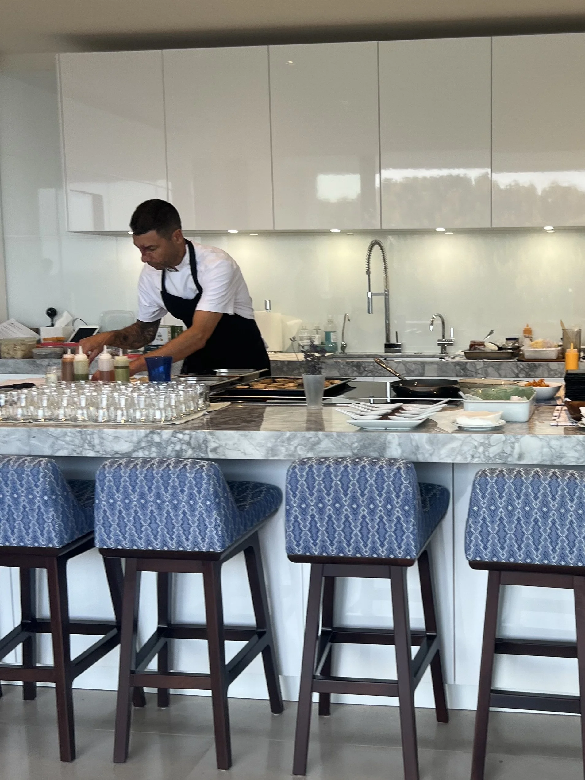 Private chef in Mallorca cooking a luxury private dining menu in a villa kitchen