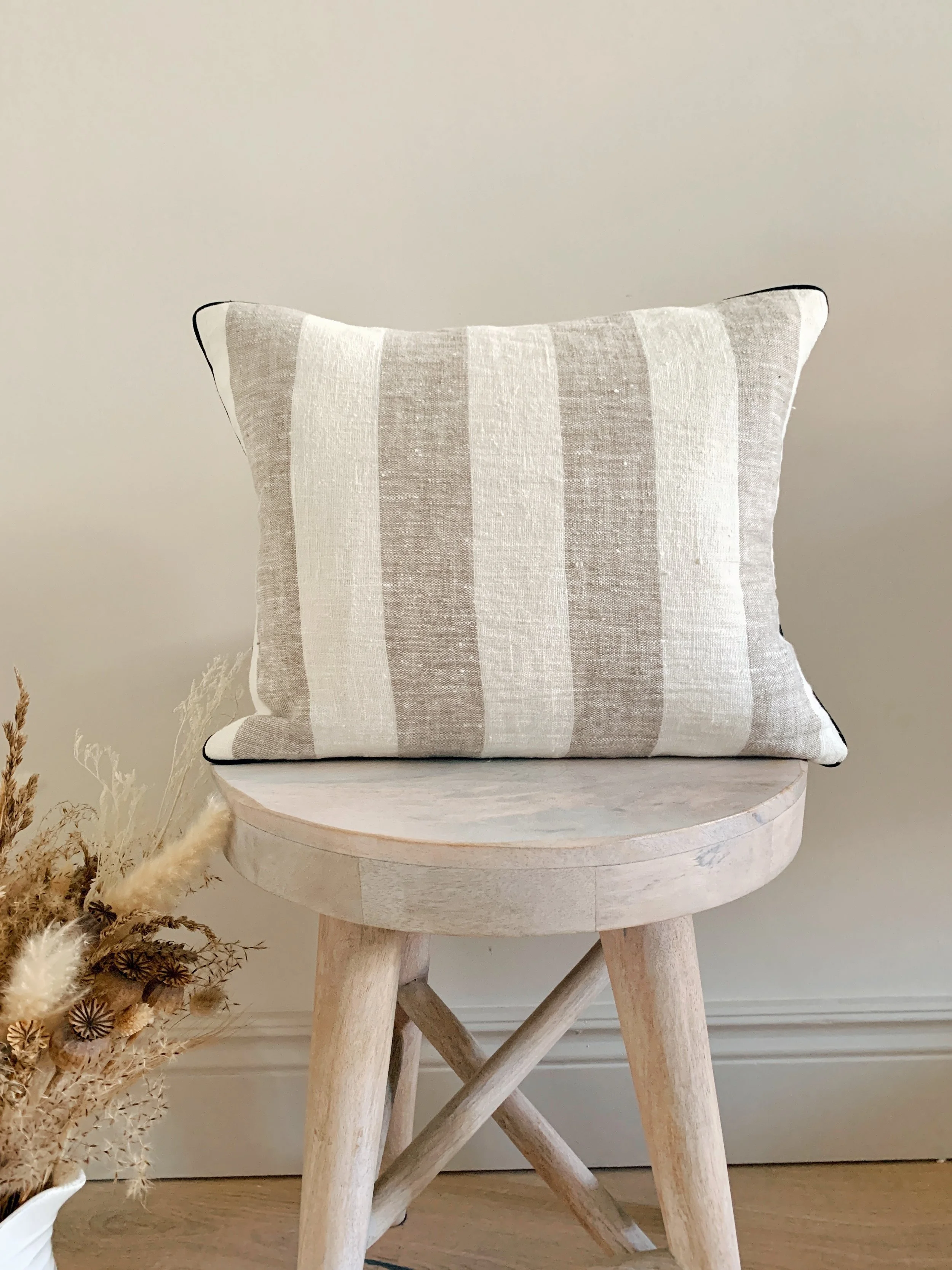 ava-striped-linen-cushion-lifestyle-stool-shot.jpg