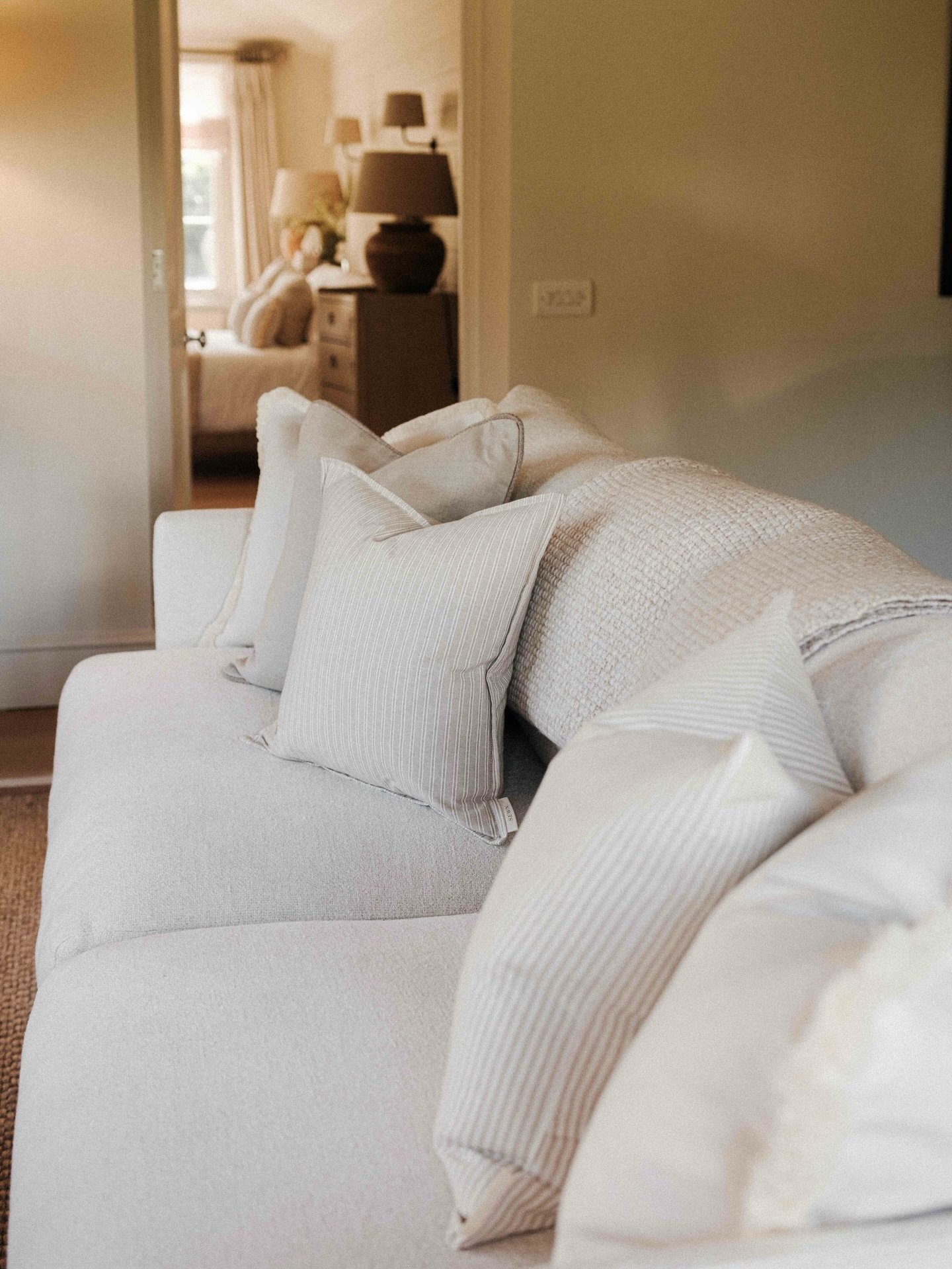 An odd number of cushions, squishy luxurious feather inners, a mix of textures and stripes and a beautiful tonal neutral palette. This one&rsquo;s for the neutral lover 🤍