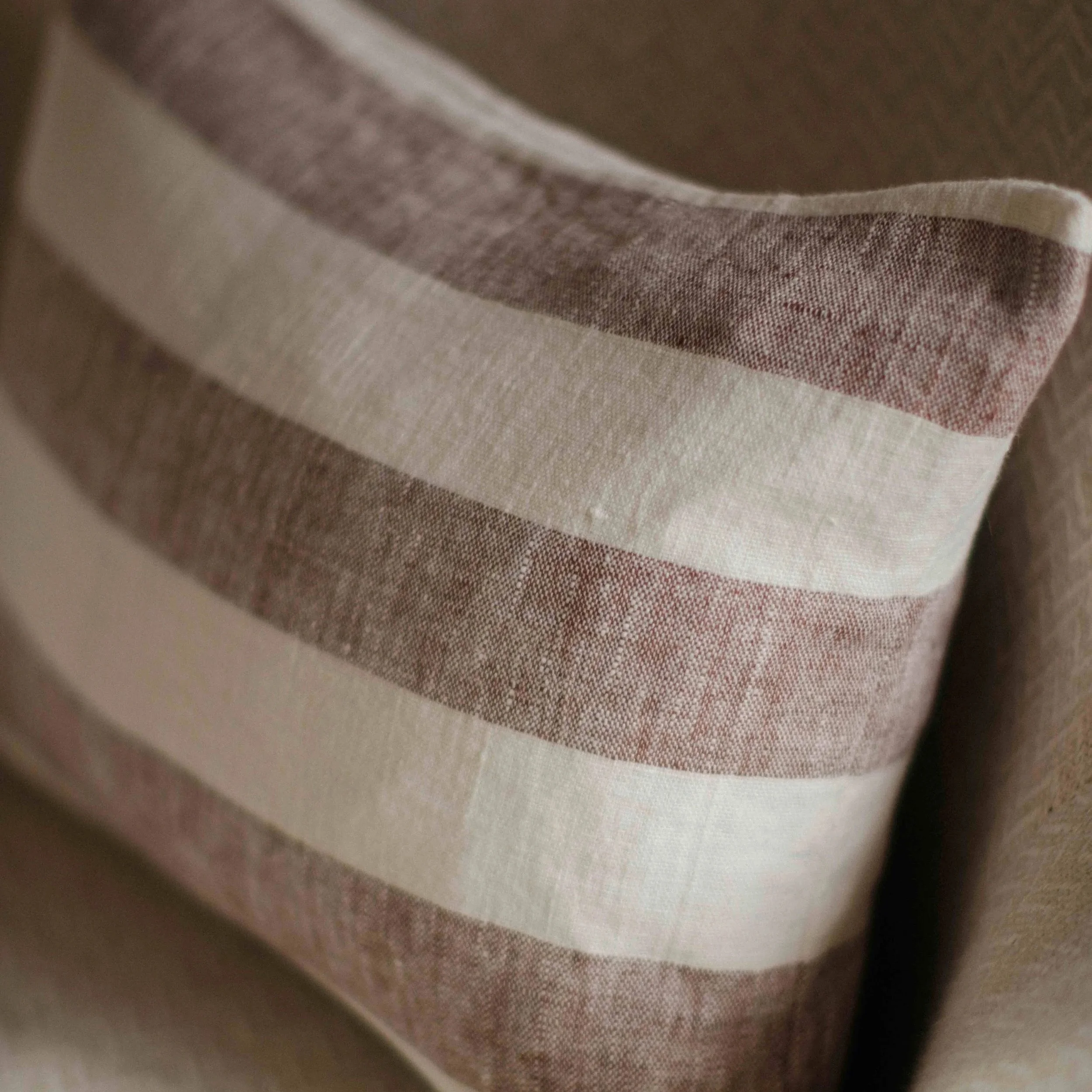 lina-brown-striped-rectangular-cushion-close.jpg