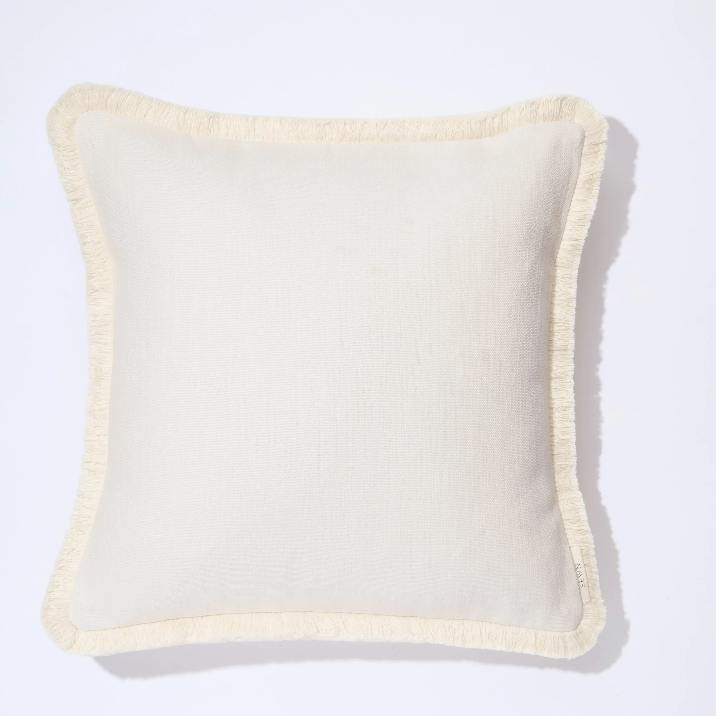 arabella-textured-cotton-fringed-cushion.jpeg