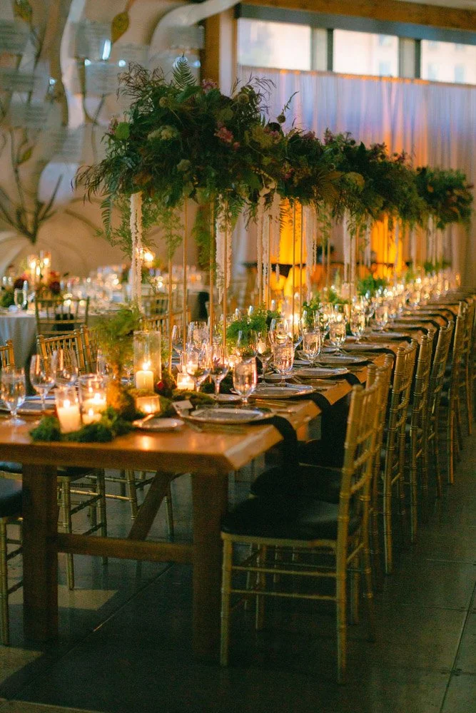 Raw edged wood kings’ tables with lush NW greens and luxurious velvet linens lit by candlelight create a beautiful reception room at the Seattle Aquarium-Photography by Precious Pics Photography-planned and designed by Simply Wed