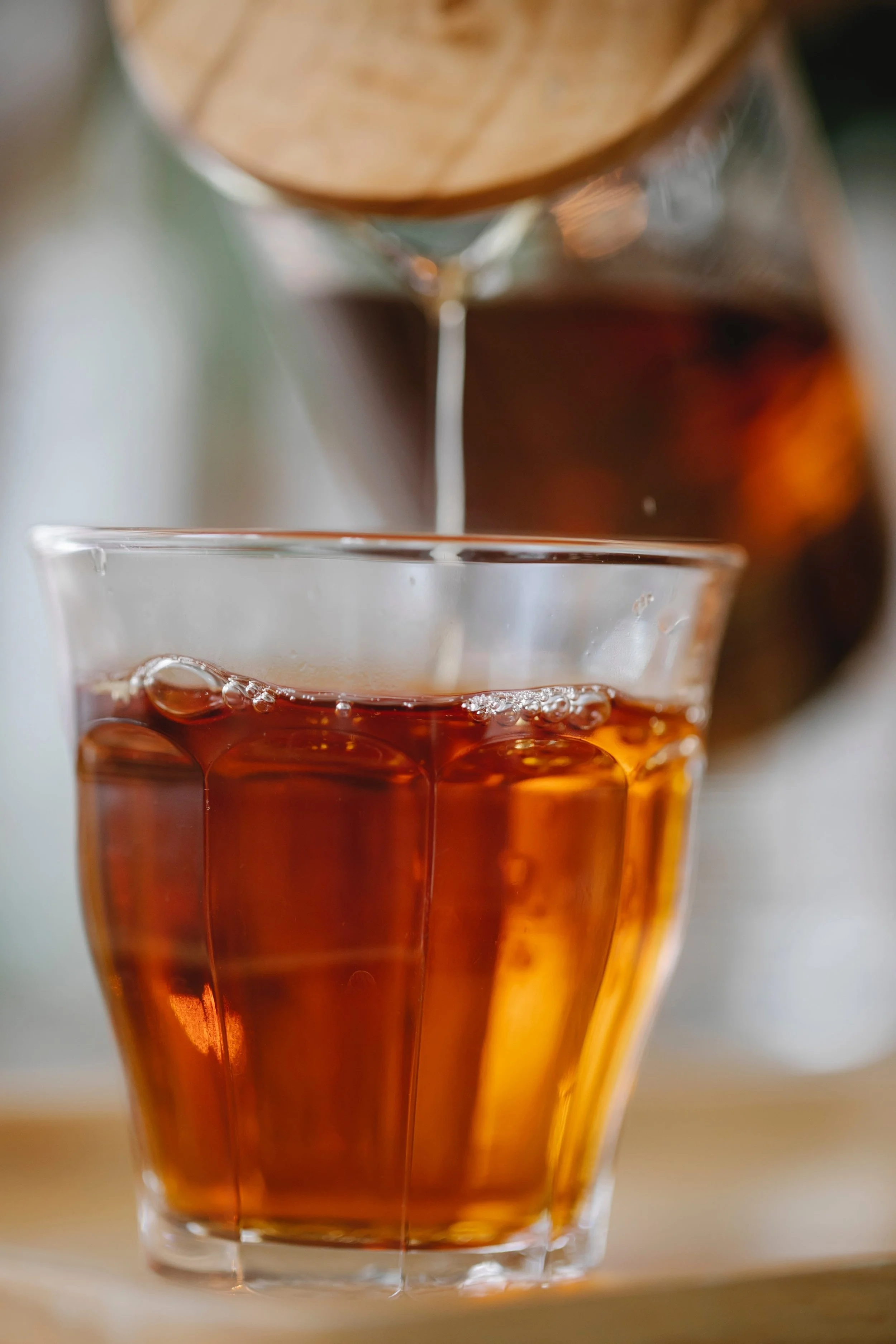 Photo by Charlotte May: https://www.pexels.com/photo/herbal-black-tea-pouring-into-glass-5946807/