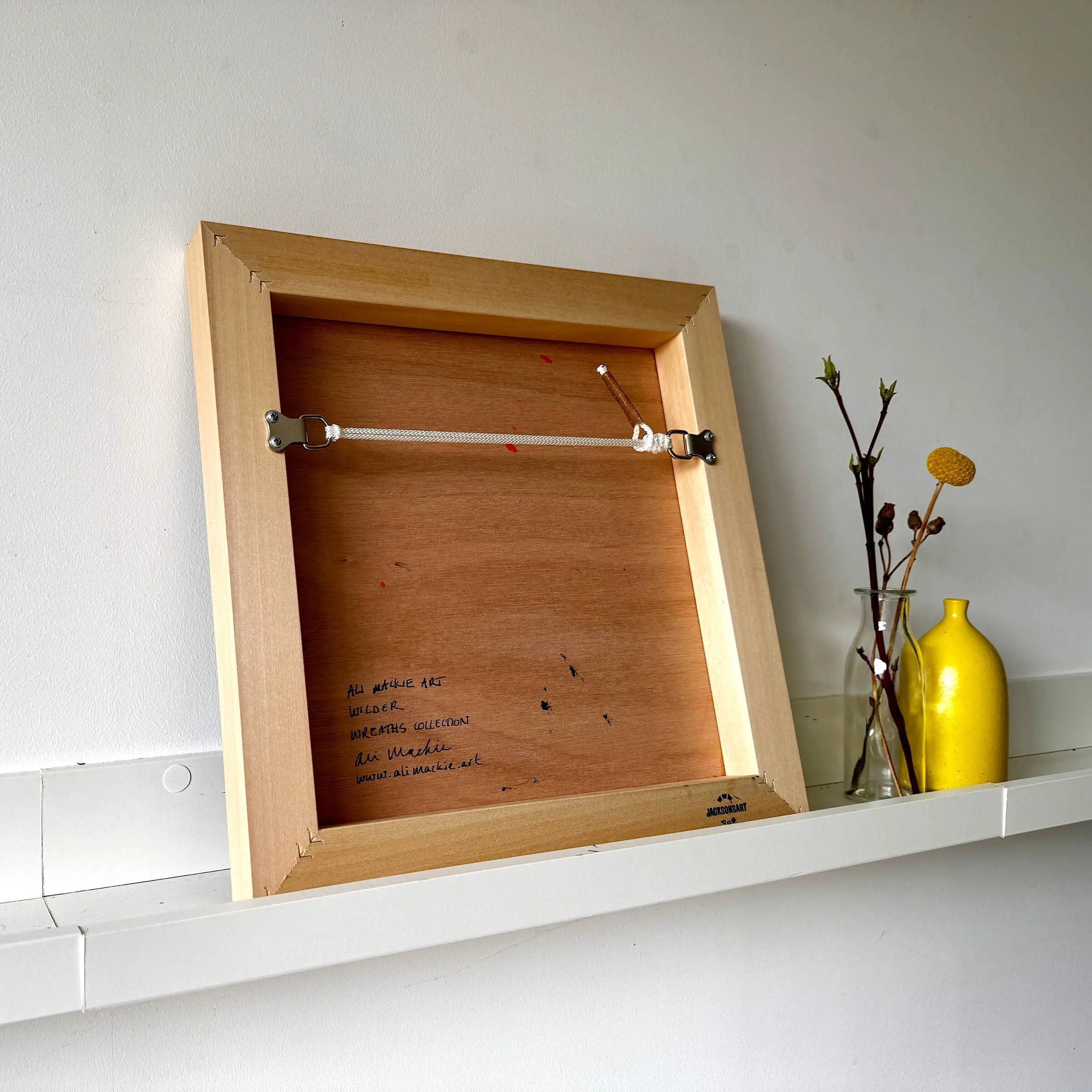 Ali Mackie Art Wilder - Wreaths back of frame for hanging
