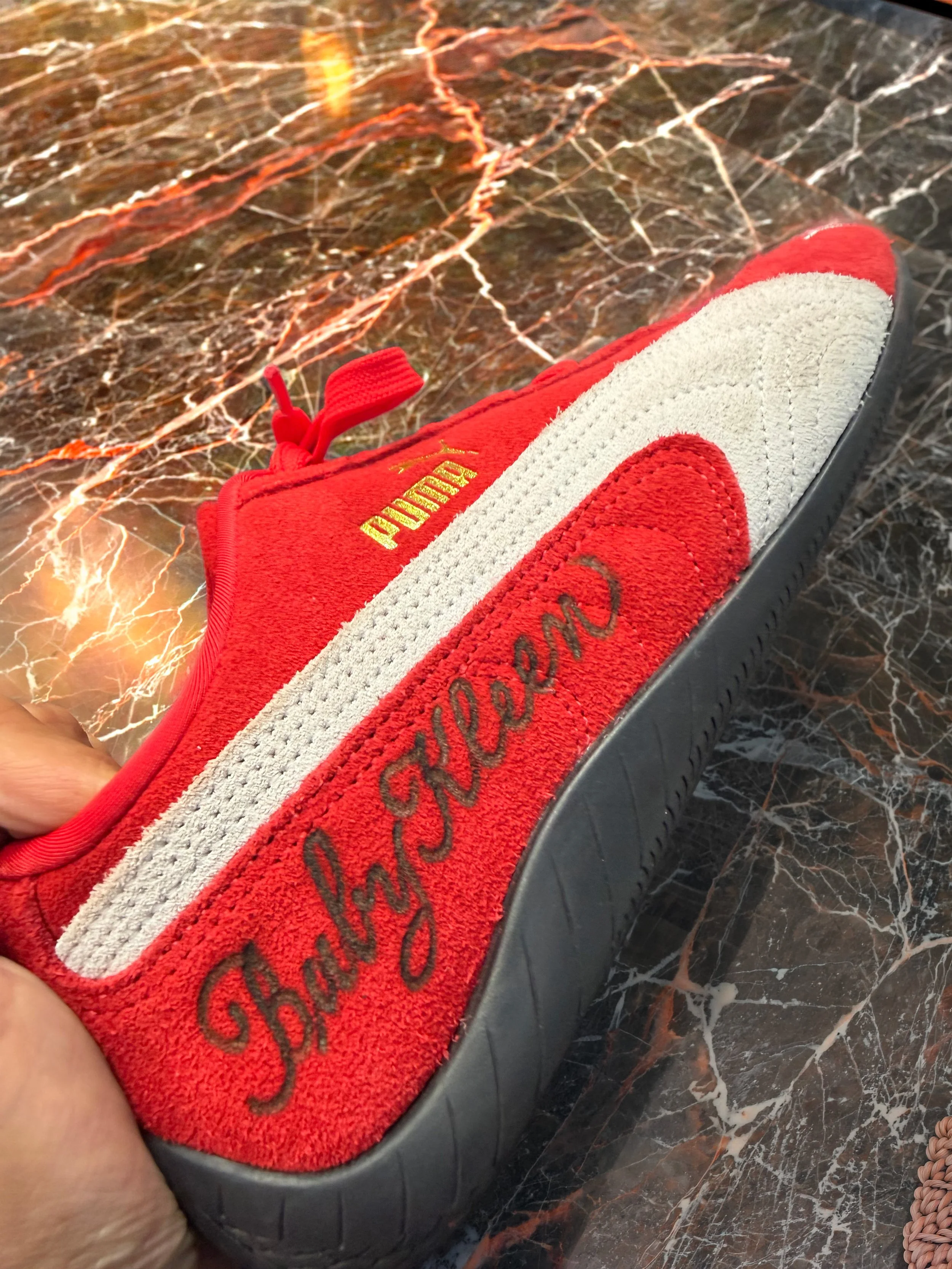Puma brand activation - Custom suede etching with a hot burning tool for lettering, calligraphy and artistic personalization in store