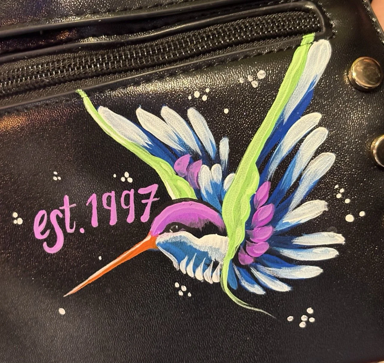 Leather bag painting for brand activation in-store events nationwide