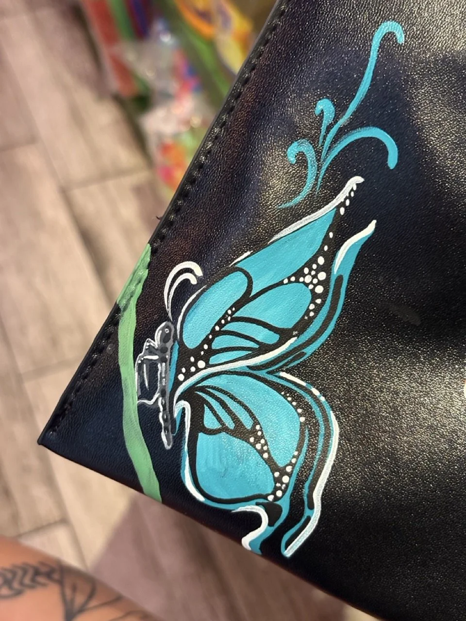 Leather bag painting for brand activation in-store events nationwide