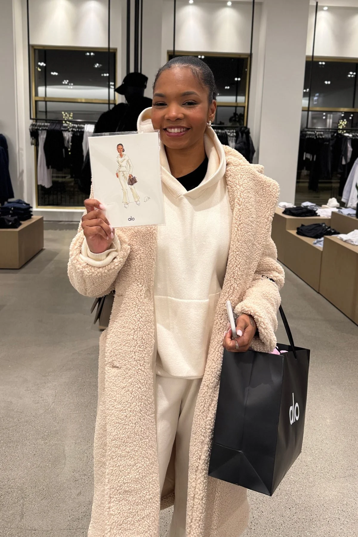 Woman at alo store brand activation with fashion illustrator from Sun Dreams Productions