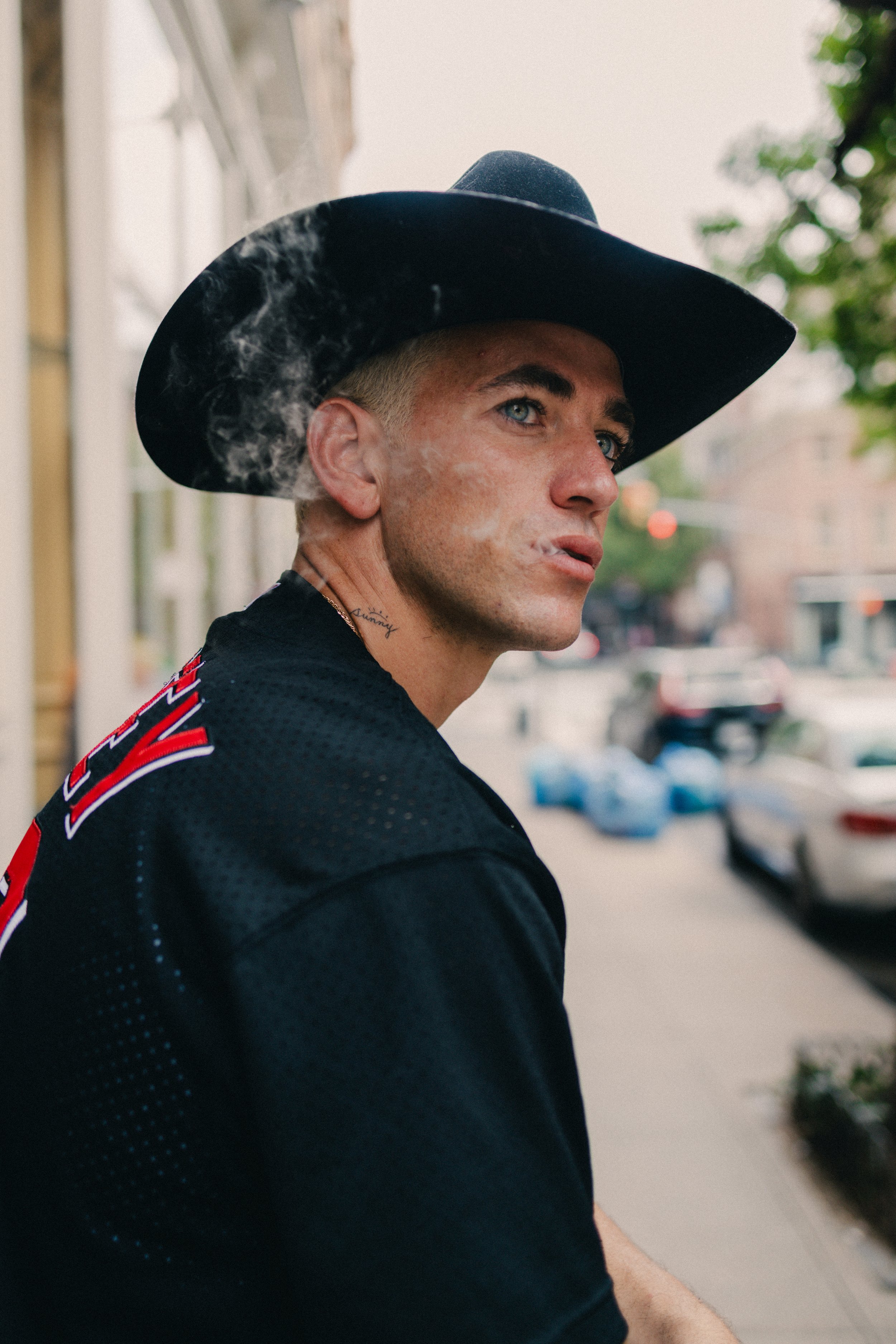 Portraits of Alexander Fine on a doorstep, New York City, 2024