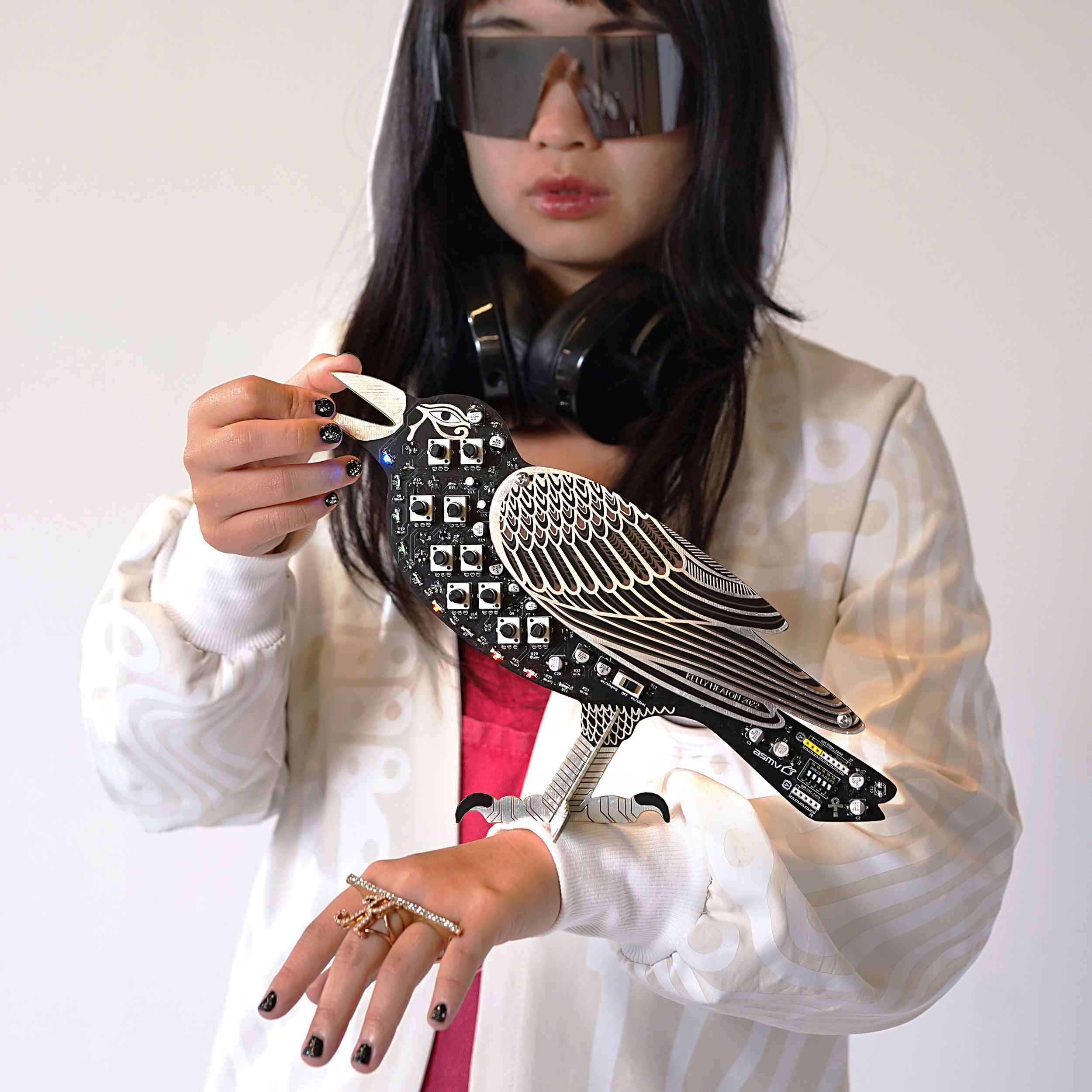 DJ holding Kelly Heaton's Nightjar birdsong synthesizer