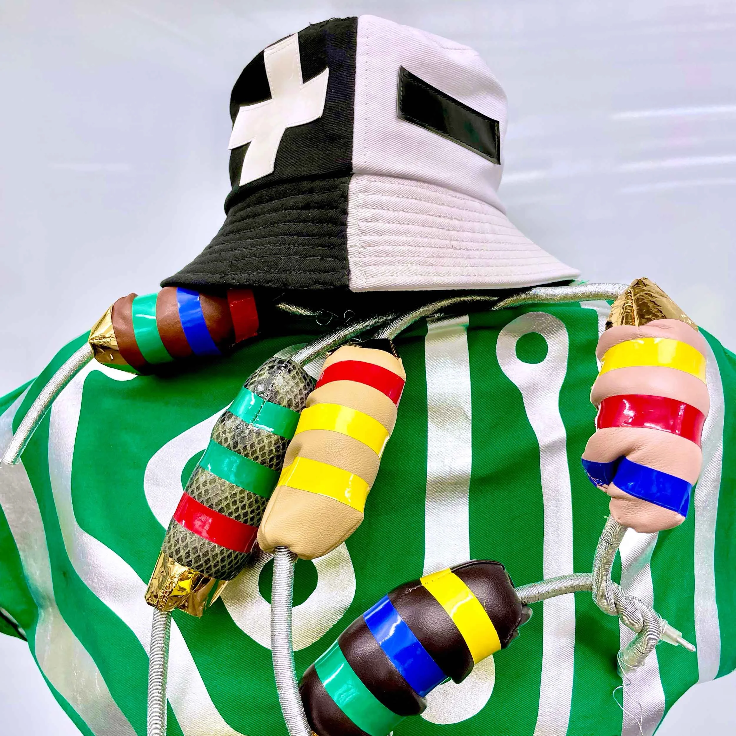 Bipolar bucket cap, free-form resistor necklace, and circuit dress