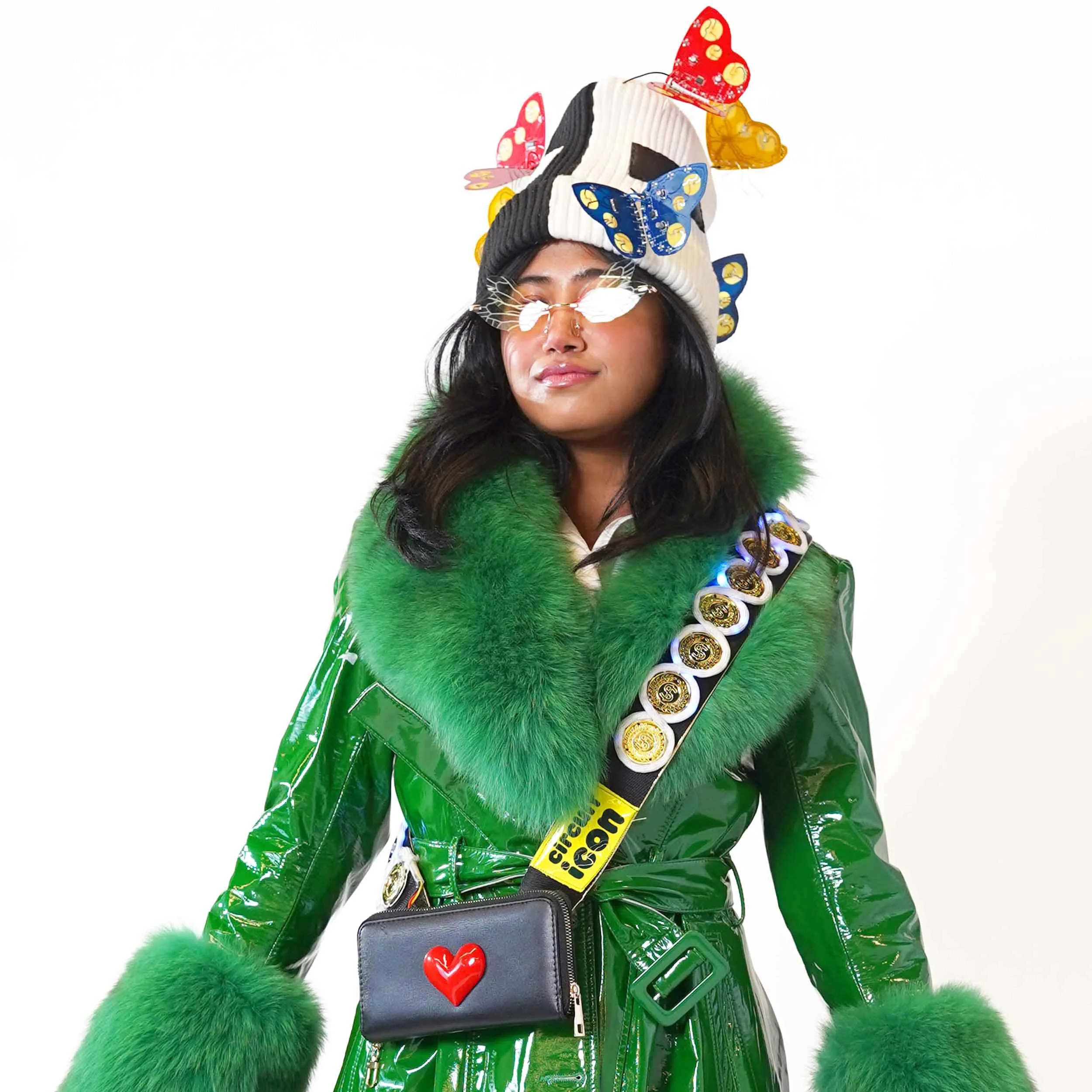 Model wearing Kelly Heaton's digital light strap with a bipolar beanie covered in electronic butterflies