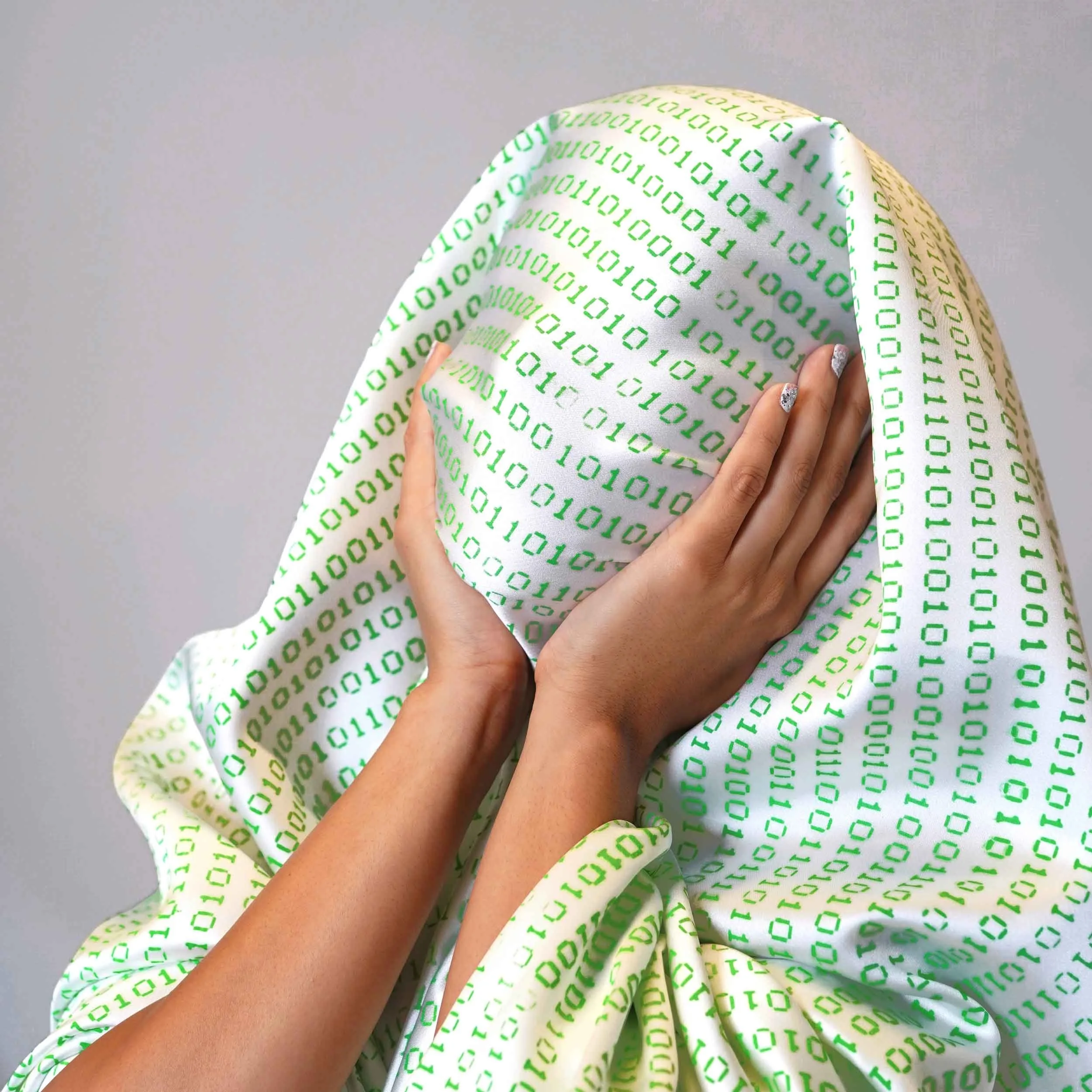 Model's face and hands with Kelly Heaton's screen printed fabric