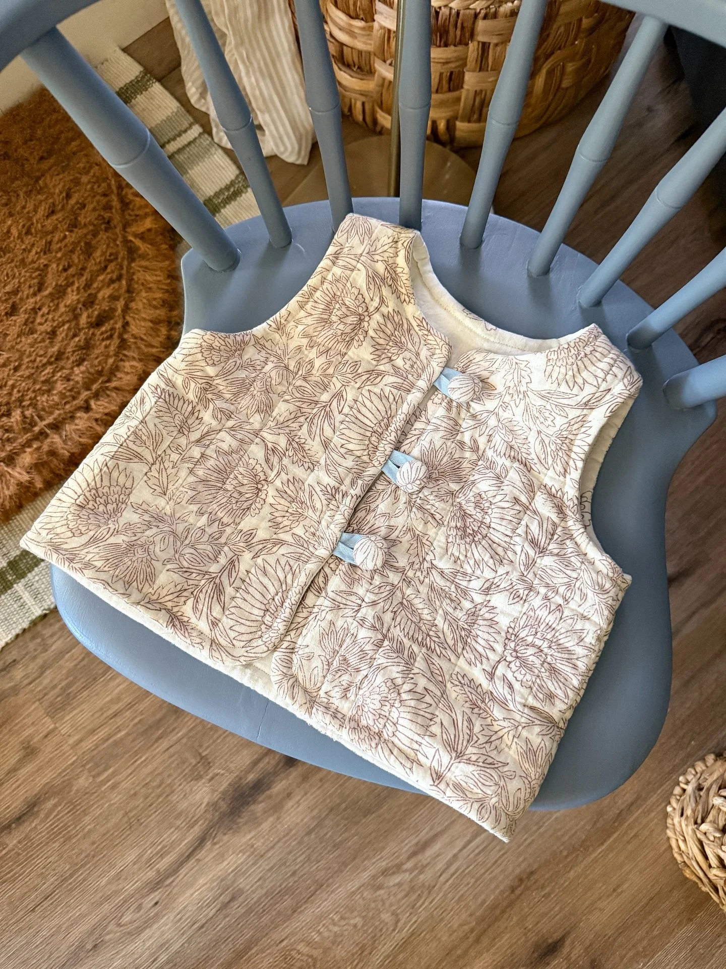 the tiniest quilted vest for my tiniest darling nona 🧸 

this was crafted entirely from a thrifted pillow sham. the blue ties are made from fabric i brought home from our summer in europe, and the buttons were part of an inherited sewing stash from 