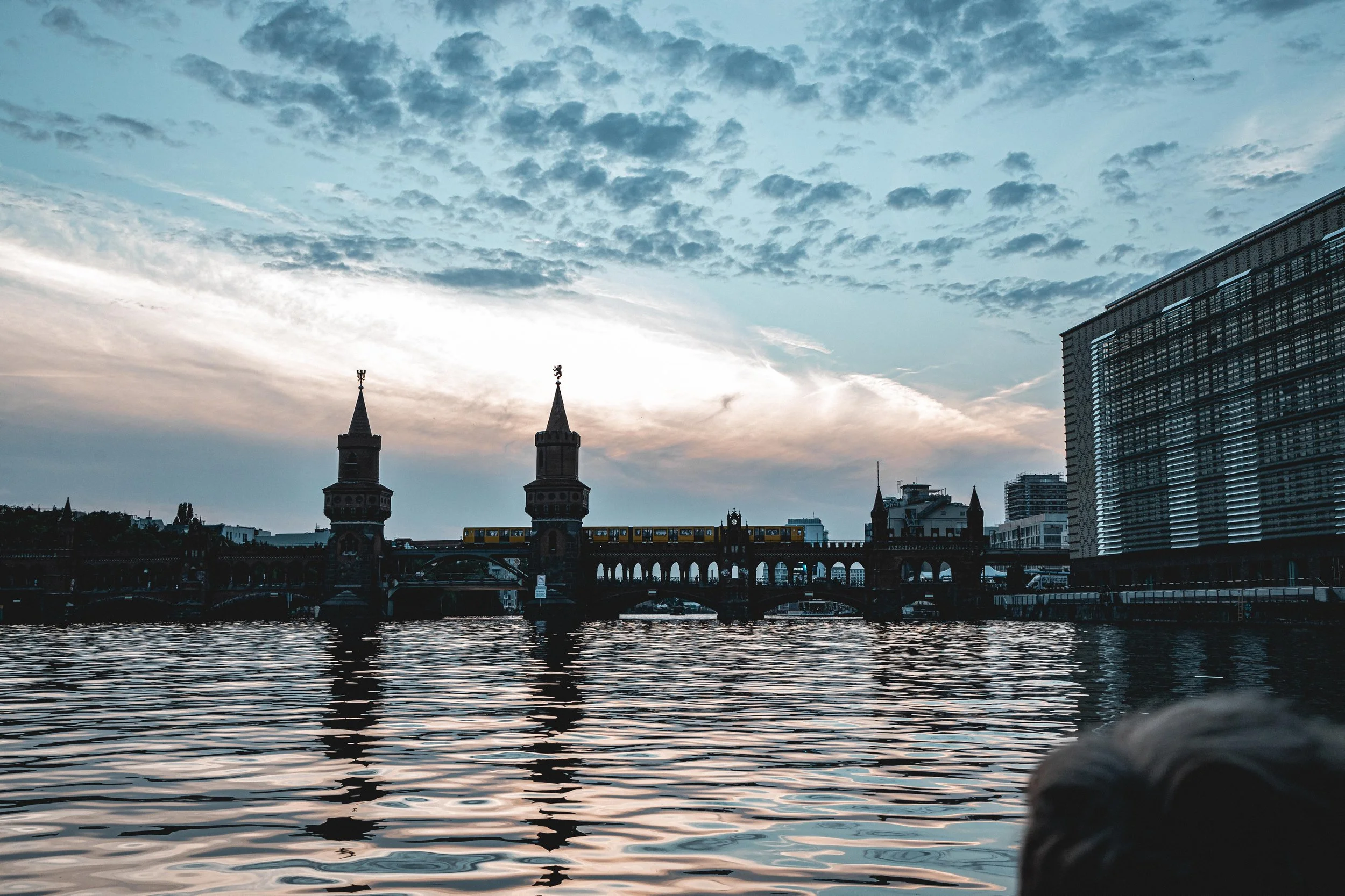 Humanist street photography in Berlin by Frankie Breakfast, capturing a poetic cloudy evening and urban landscape. Available as fine art prints.