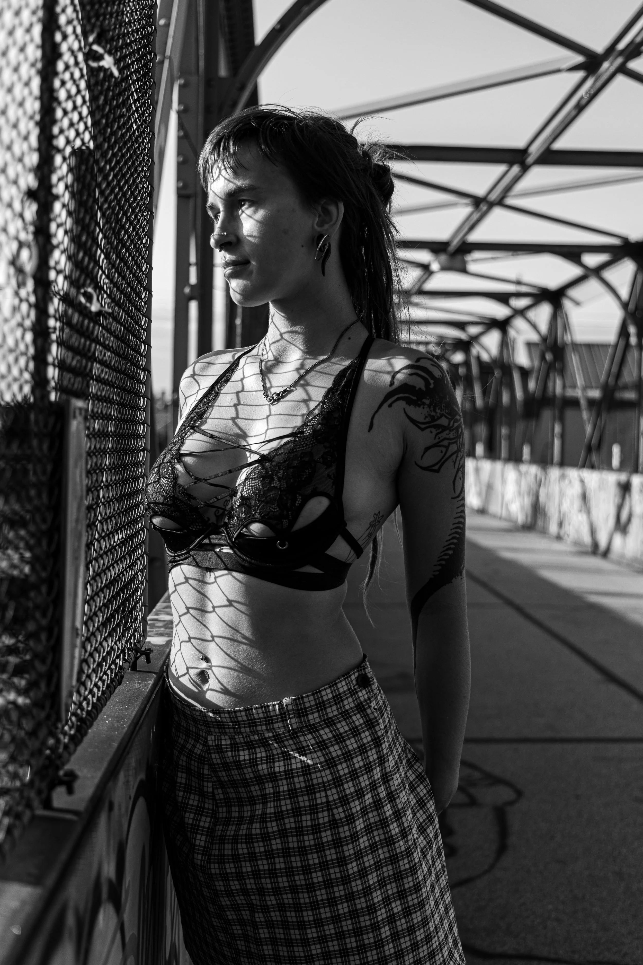 Artistic nude photography by Frankie Breakfast, exploring the interplay of light and shadow through a minimalist figure study.