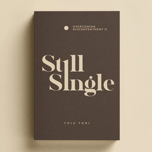 Cover of a book titled 'Still Single' by Toju Tori, part of the 'Overcoming Discontentment II' series, with a minimalistic design on a beige background.