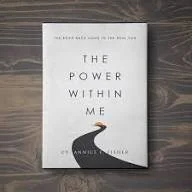 The book titled 'The Power Within Me' with a black silhouette of a creature on the cover.