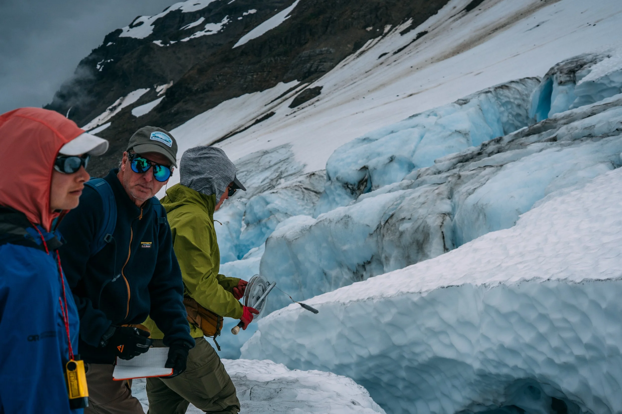 The North Cascades Glacier Memorial Project team taking crevasse measurements, Rainbow Glacier, Mt. Baker, August 2025
