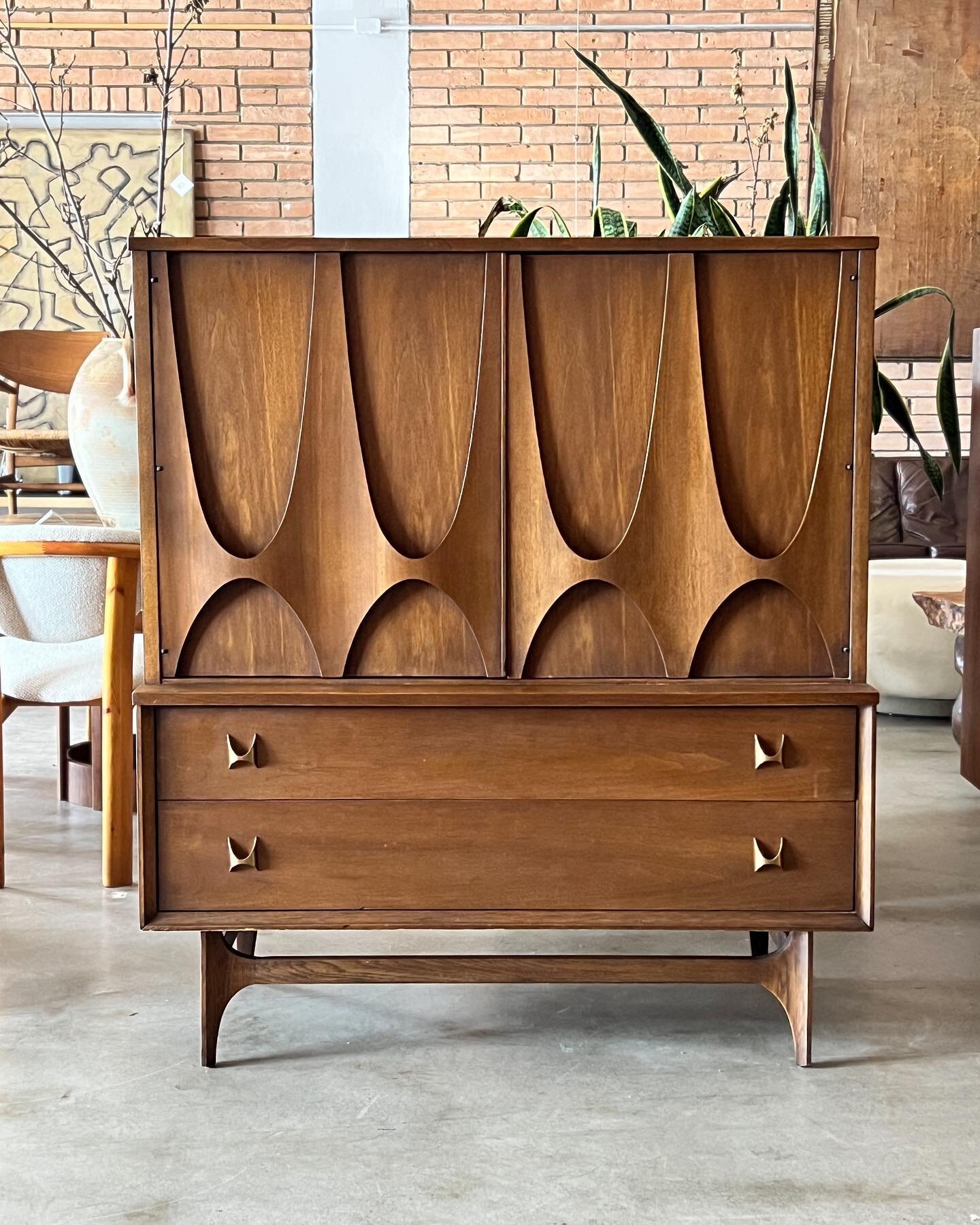 Just in 
.
.
Broyhill Brasilia tall dresser in walnut, c. 1960s. This is the example with the large swooping door fronts for that extra movement. Nice vintage condition. DM for details or questions
. 
44&rdquo;W x 19&rdquo;D x 50&rdquo;H 
.
.
#broyhi