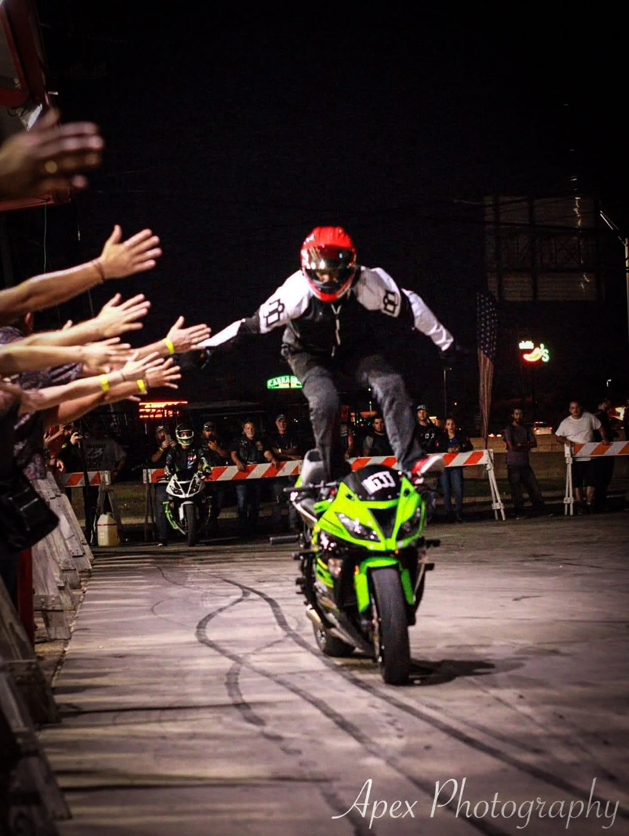 Ian Gaines engaging a crowd during a professional motorcycle stunt show