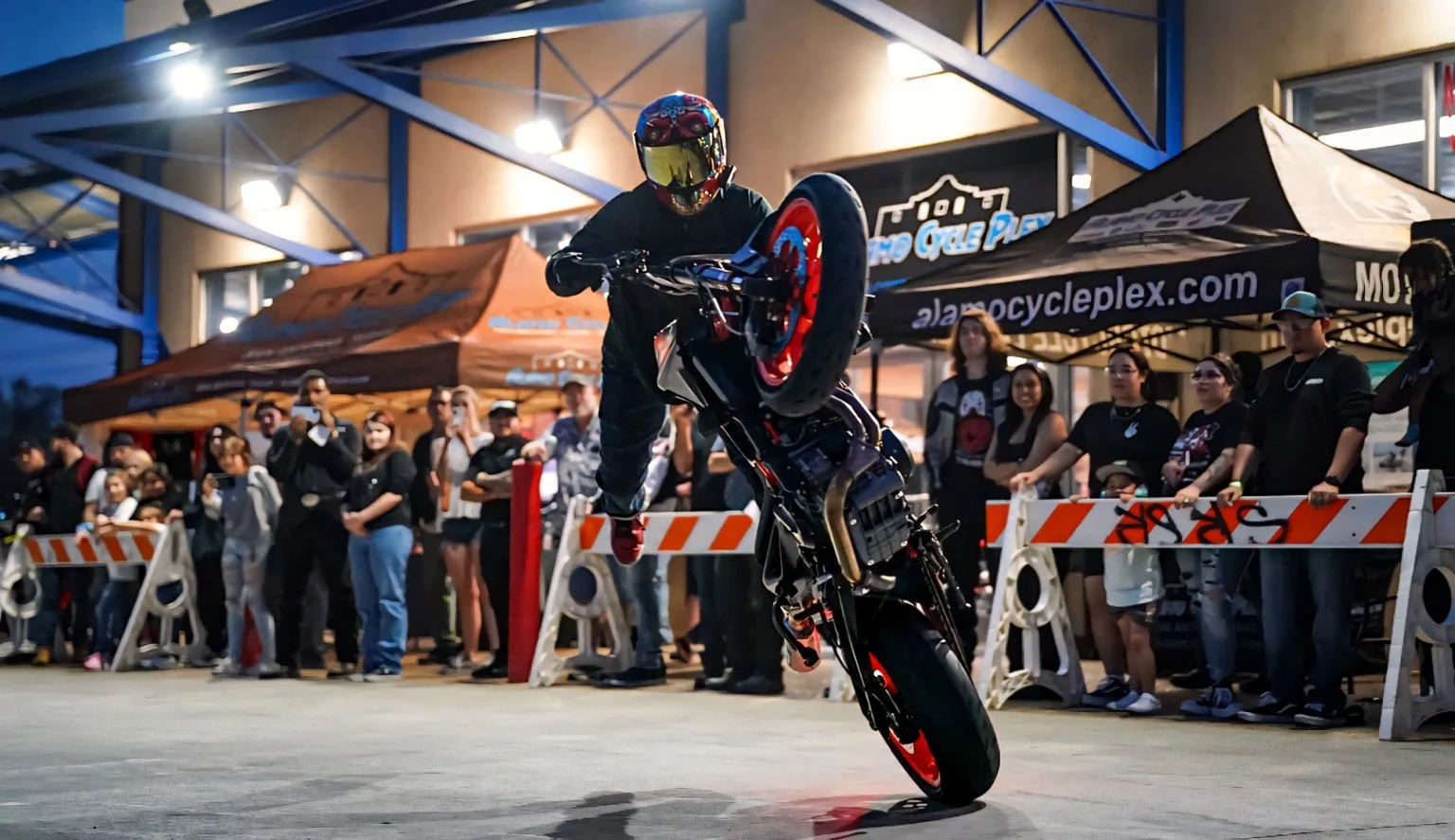 Ian Gaines performing a professional motorcycle stunt show before a live crowd