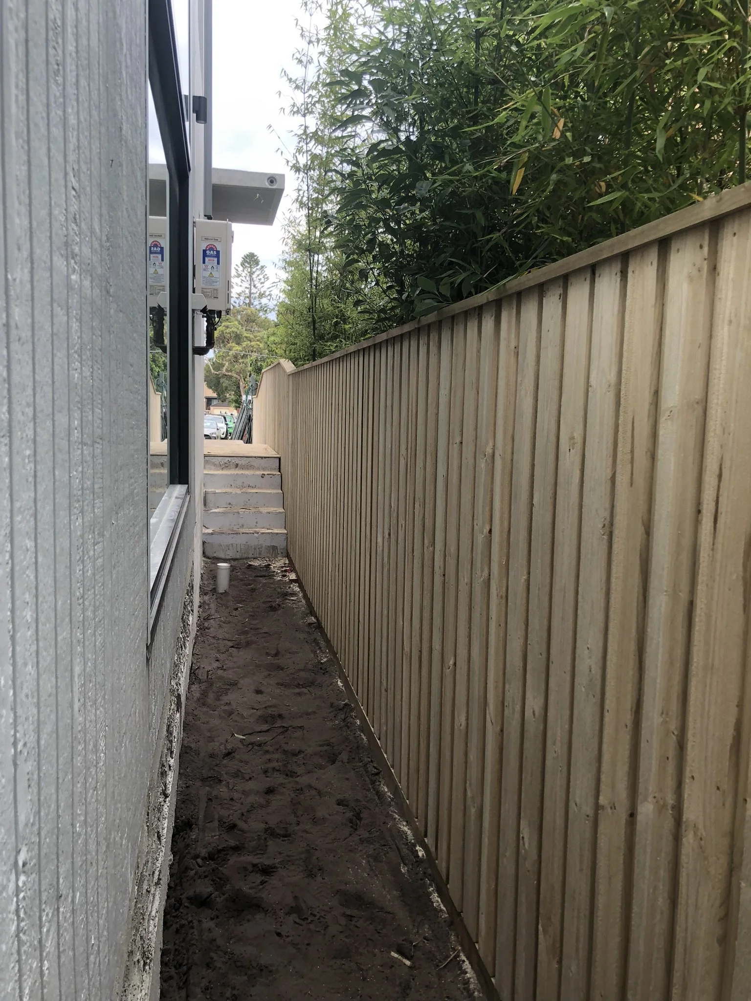 Treated pine lapped and capped boundary fence install. Eastern Suburbs