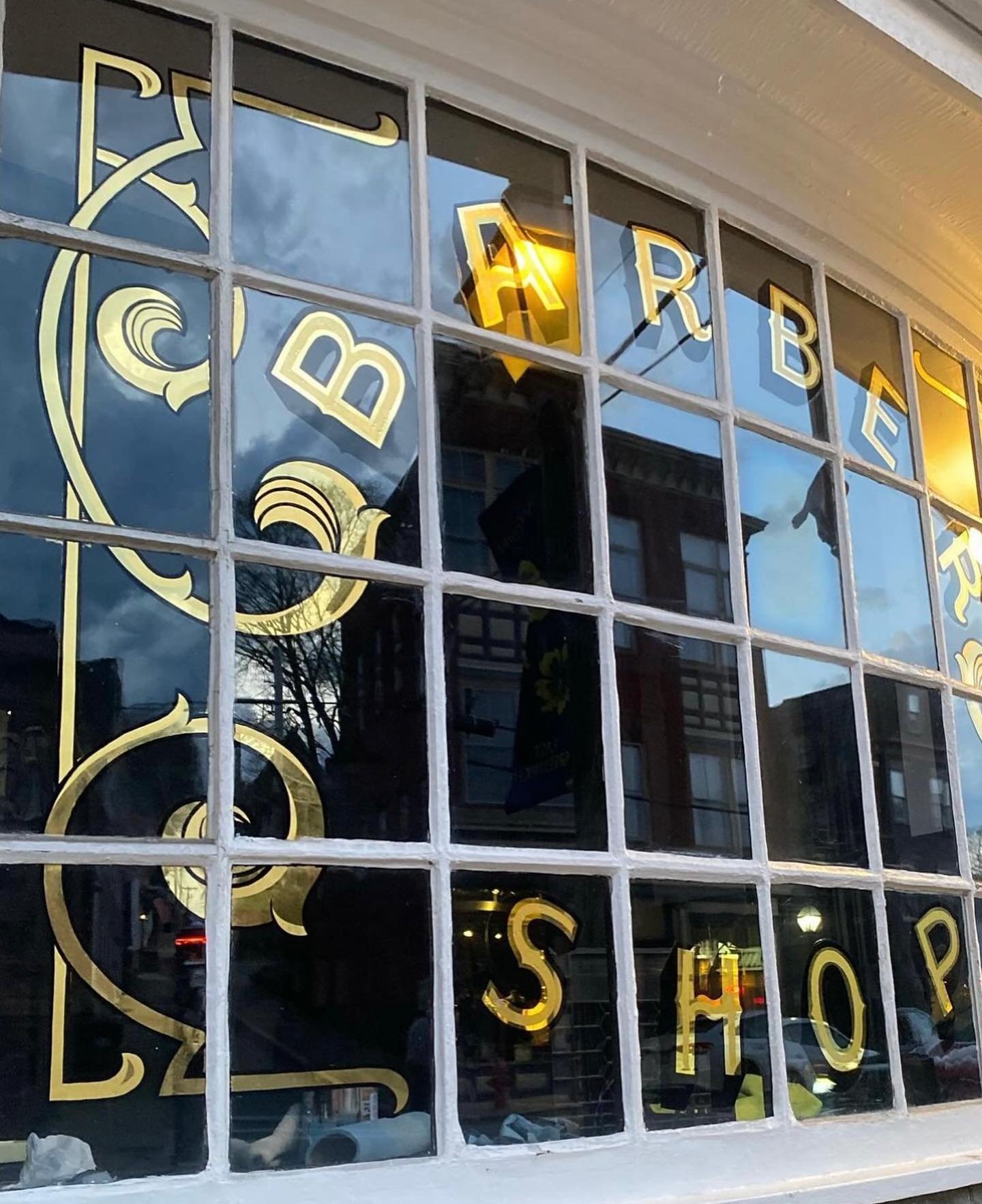 Finished window lettering at the shop by @letterluxe_signs.  All lettering and filigree is 23c gold leaf applied by hand!