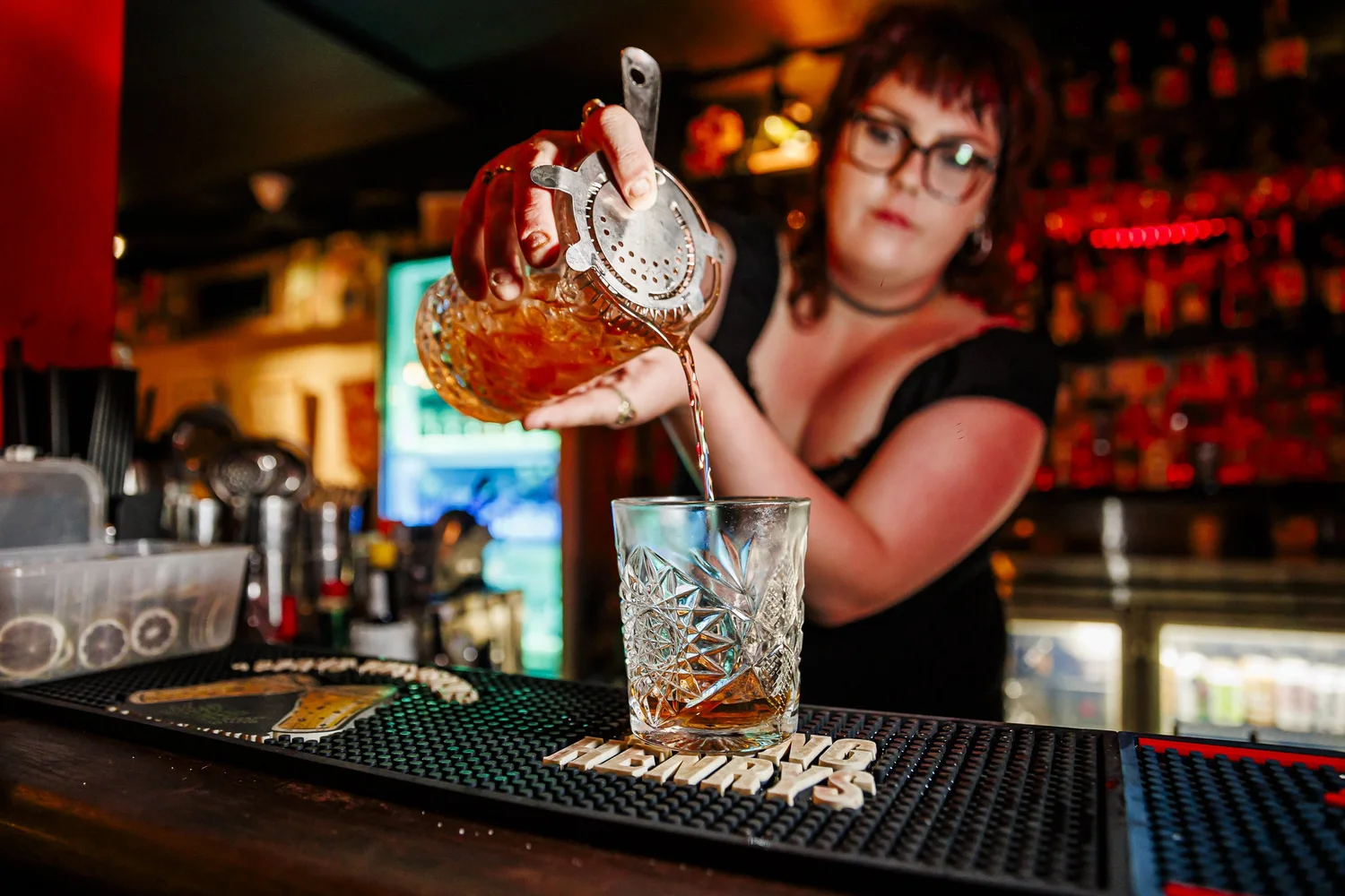 Bartender mixing a cocktail at Brew laneway bar Brisbane