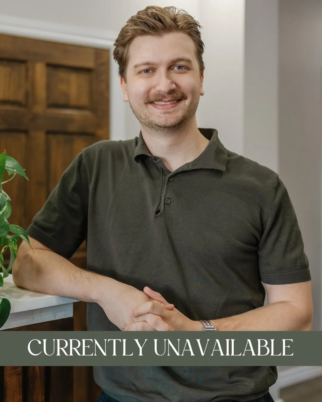 Ryan LeRoux, RP (Qualifying) - A smiling man with light brown hair, wearing a brown cable-knit sweater, and leaning on a wooden counter with a green leafy plant nearby and a caption that reads "Accepting New Clients."