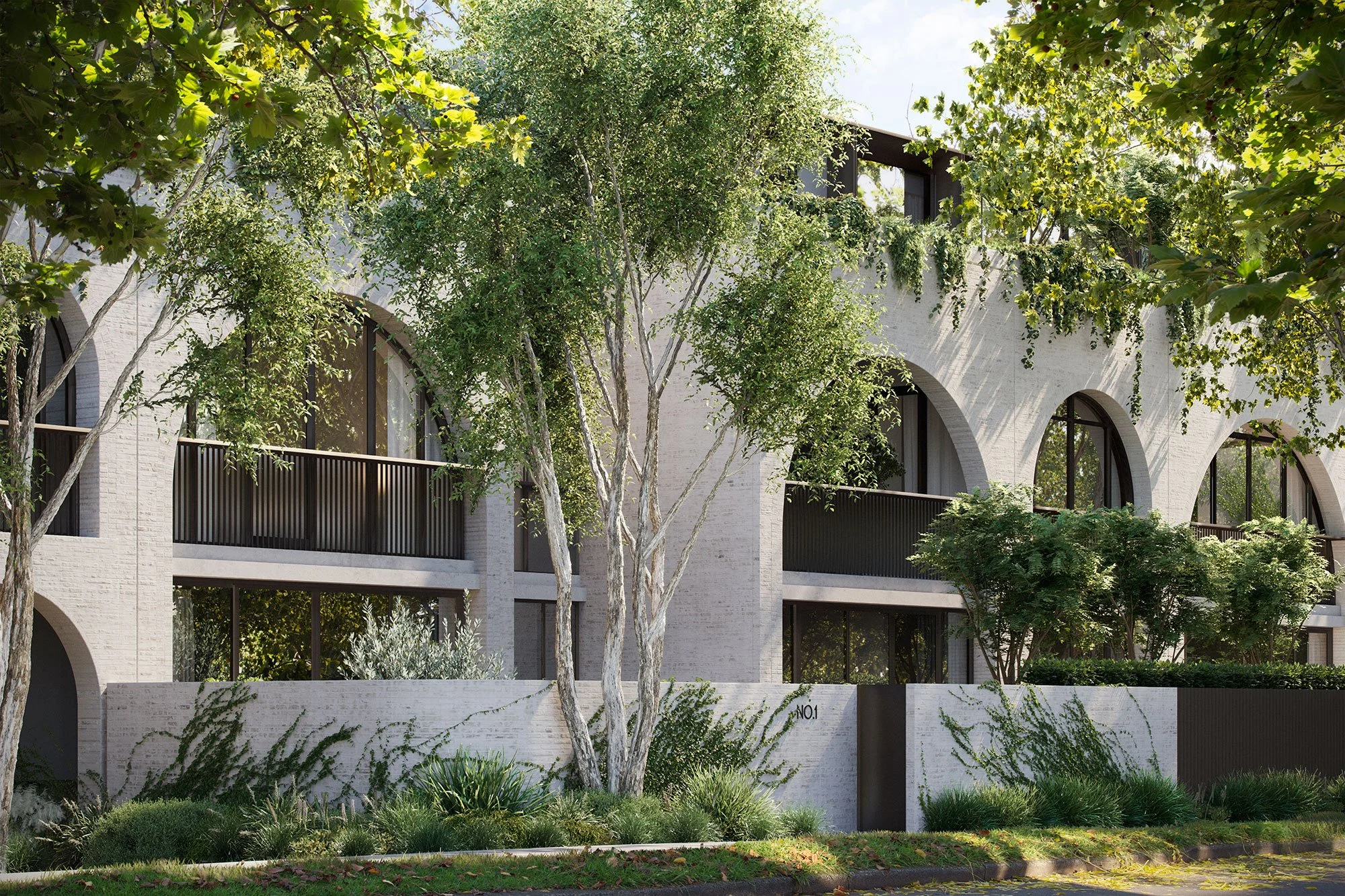 Modern residential building with large arched windows, surrounded by lush greenery and trees. The facade is made of light-colored bricks and features balconies with railings. Ivy and plants are growing along the walls.