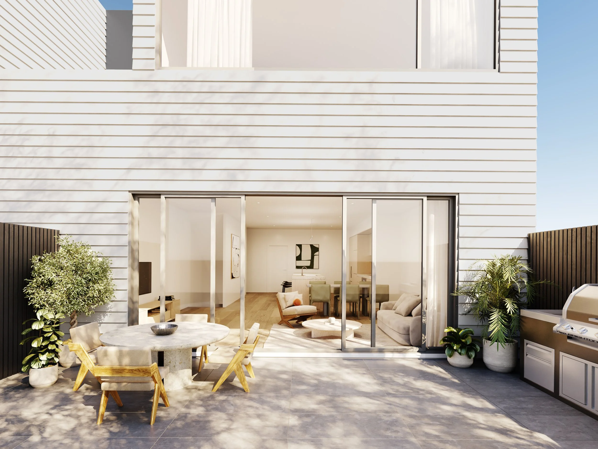 Modern backyard patio with outdoor table and chairs, potted plants, and a built-in grill. Large sliding glass doors open to a contemporary interior living space.