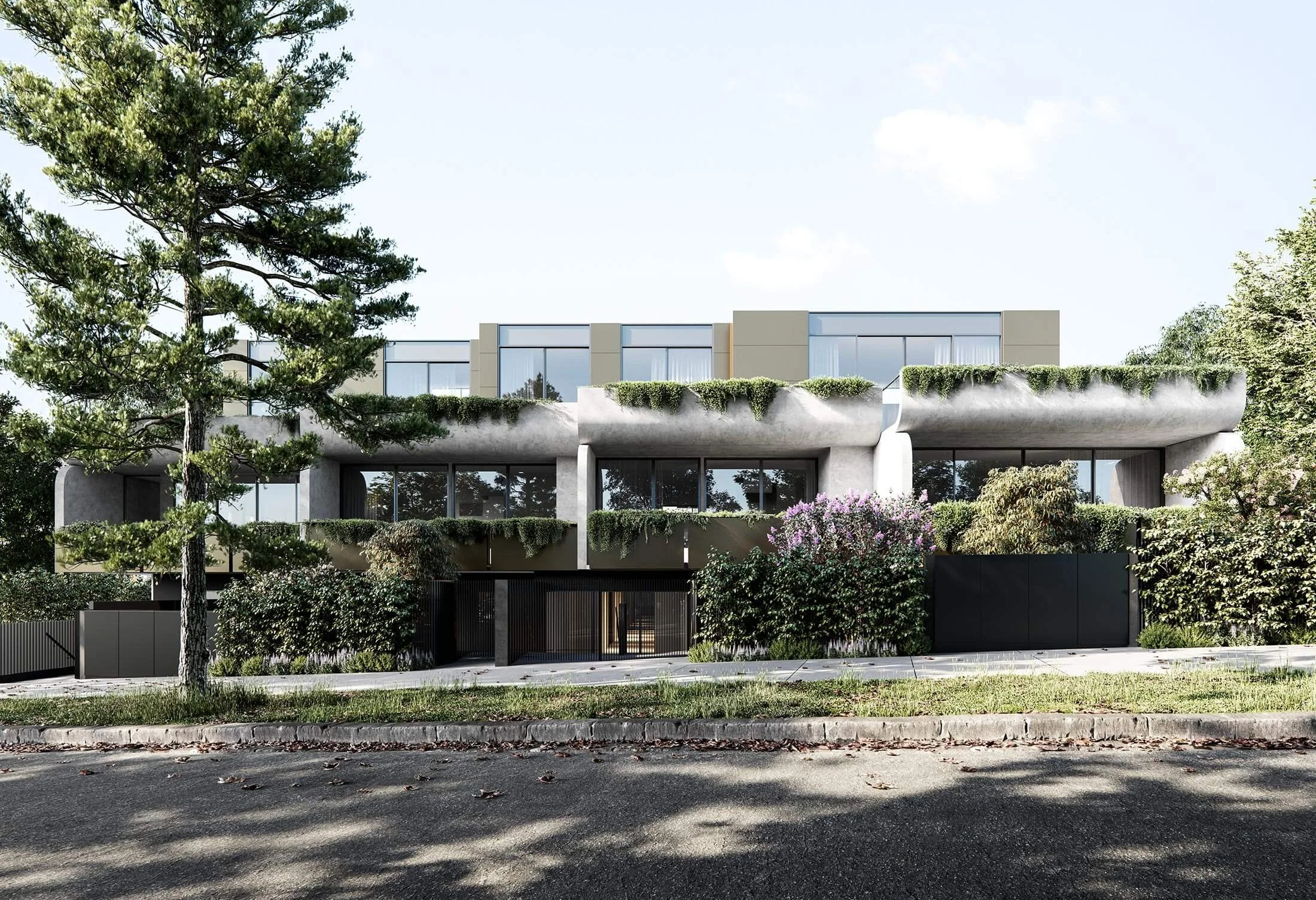 Modern multi-story building with large glass windows, surrounded by trees and greenery, with a concrete and black gate in front.