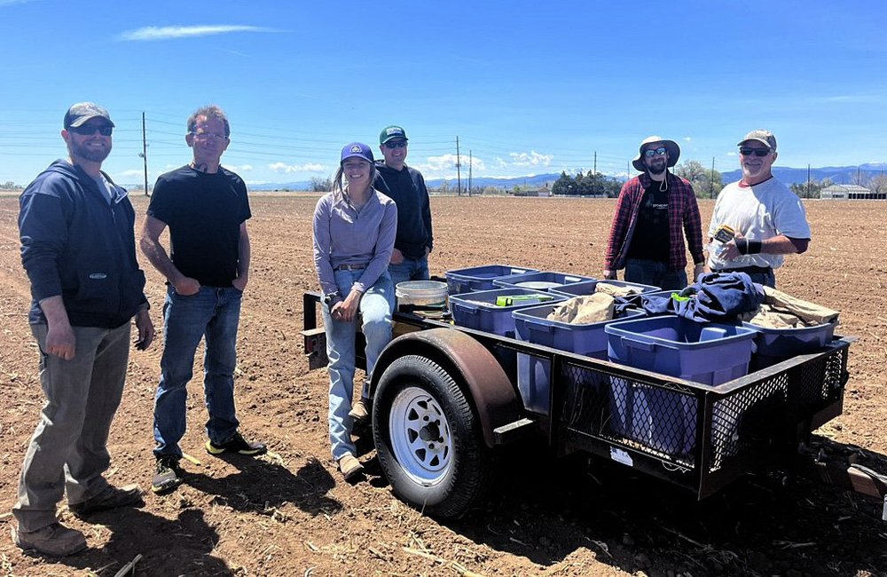  The planting crew paused after each row of plots, as the planter turned to make the next pass. 