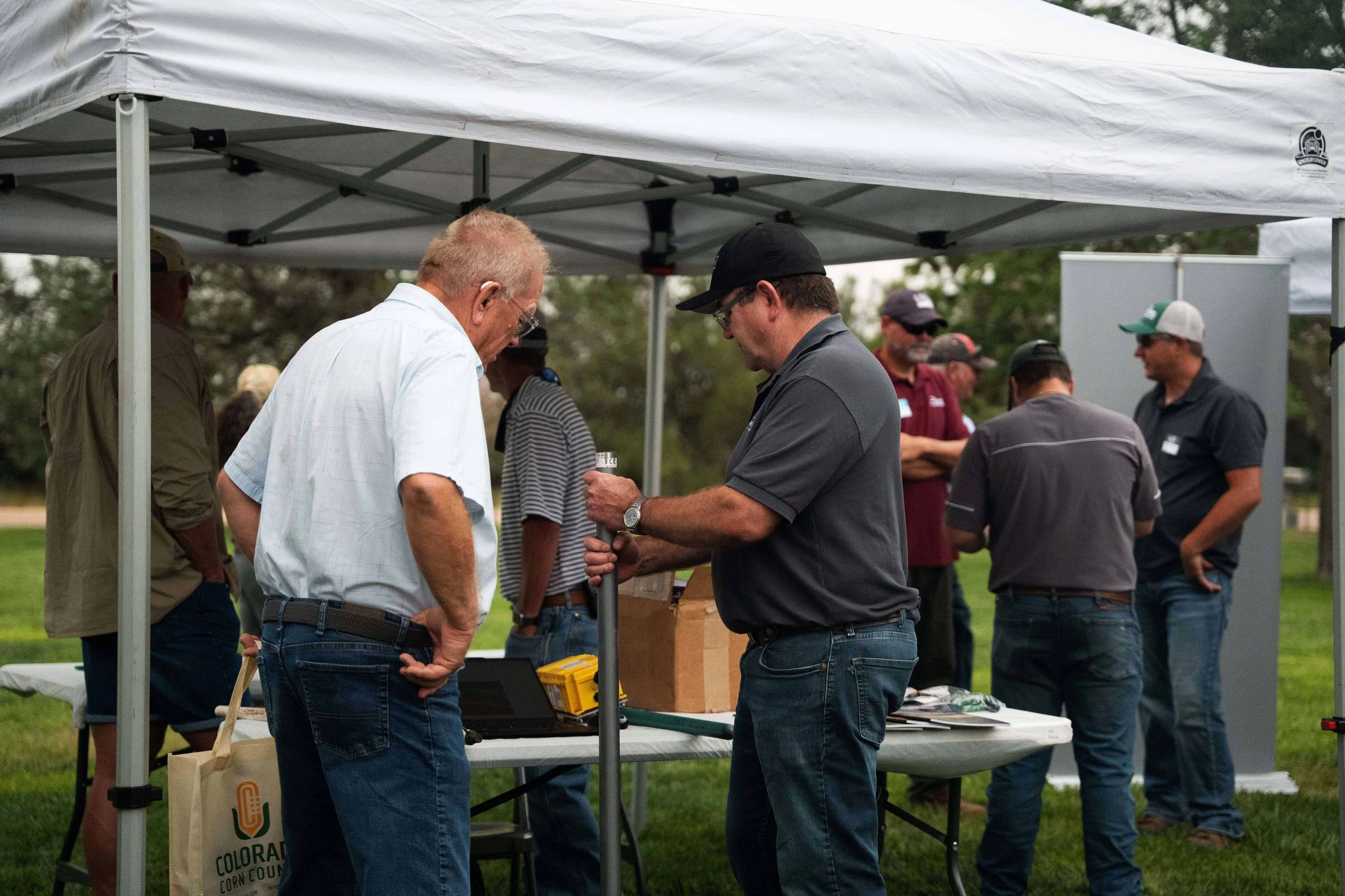  David Sloane of GoAnna Ag walks through a soil moisture sensor with CSU-TAPS competitor Brent Francen. GoAnna Ag was one of 15 partners in the TAPS Tech &amp; Partner Showcase. 
