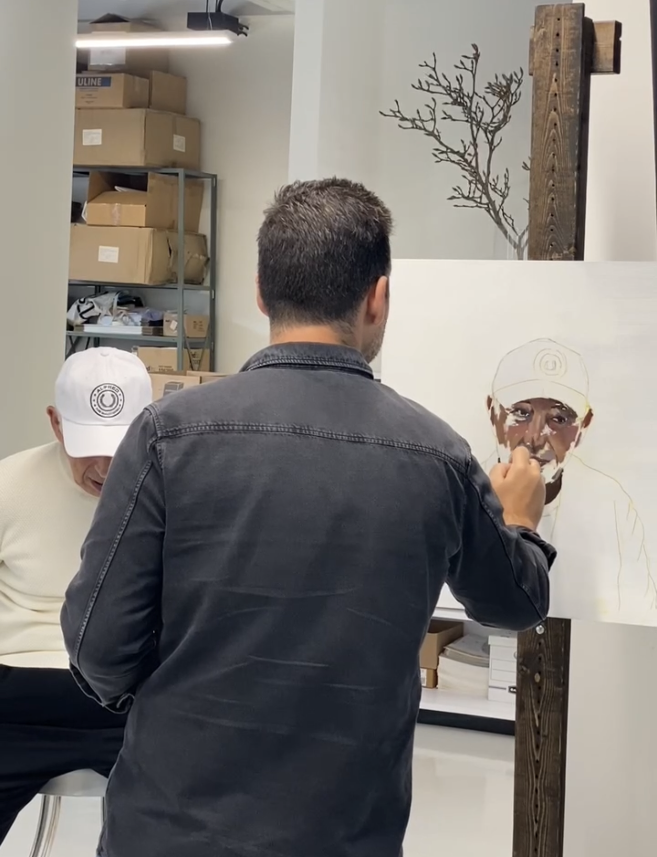 Canadian portrait painter working on a portrait commission in the studio