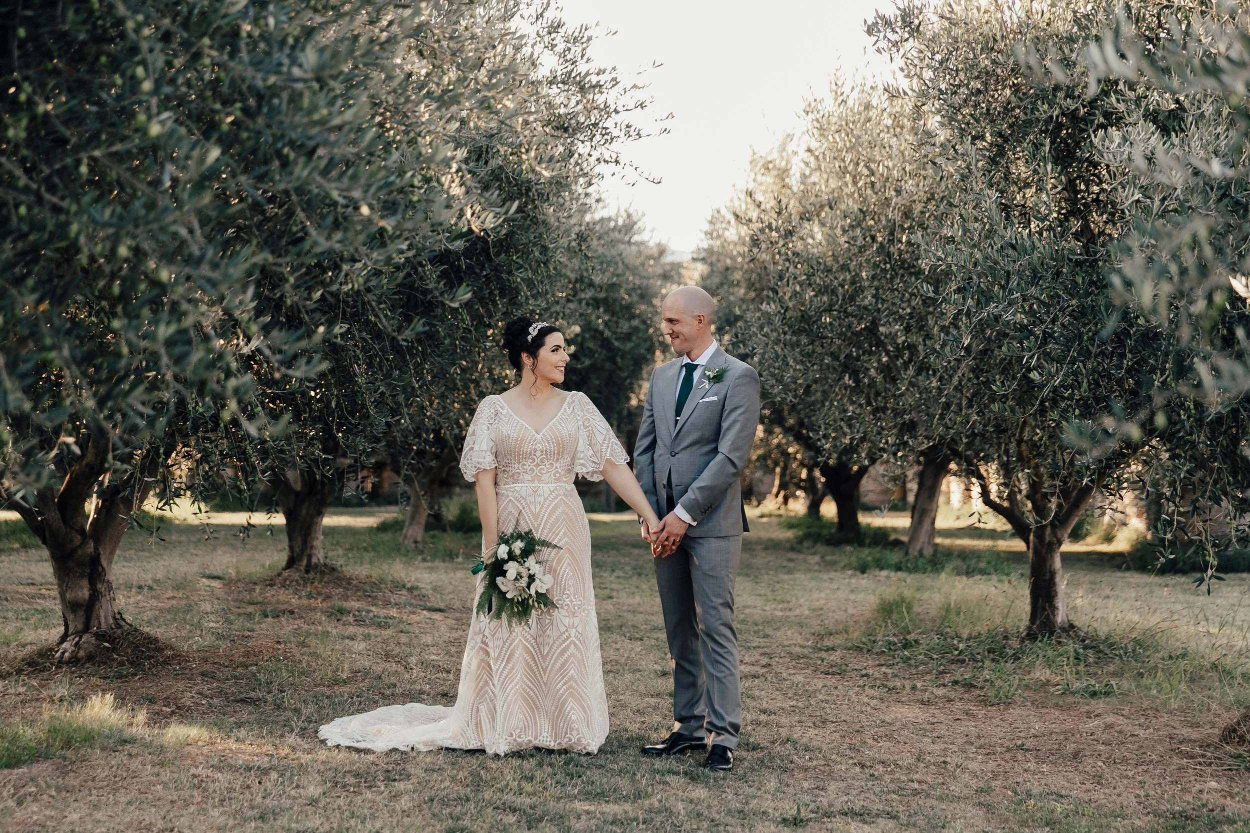 The sun drenched paddock and Olive grove at Pialligo Estate Canberra was the perfect backdrop for fun wedding portraits with Nadia and Nick.