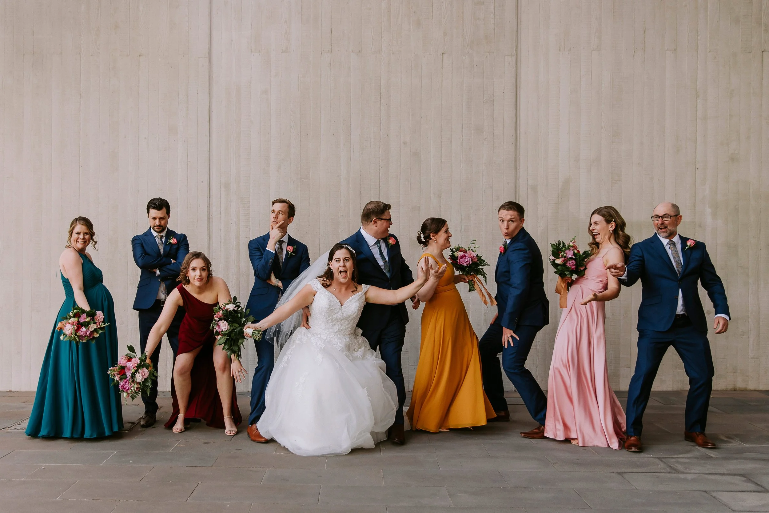 Wedding party portraits should not be boring. They should be fun, filled with laughter and connection! 
