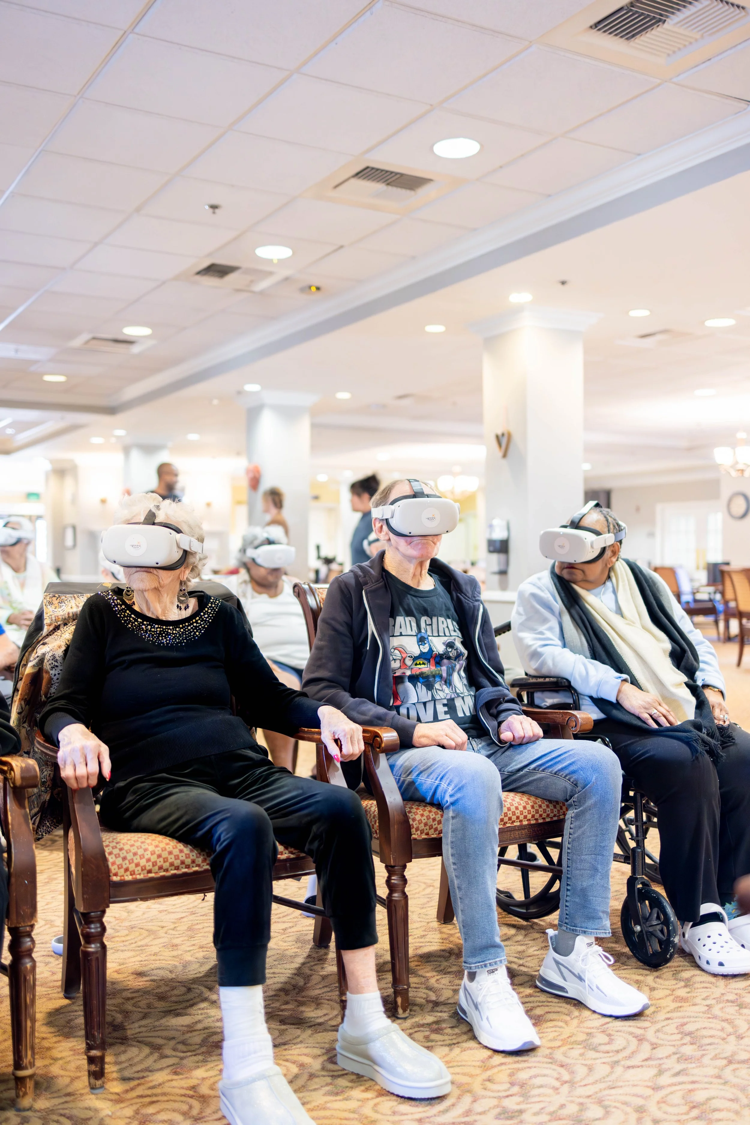 Senior residents enjoying a Lightning Tours group VR experience