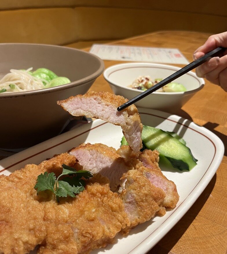 Check out that juicy, tender pork chop encased in a golden, crispy batter. #drool
