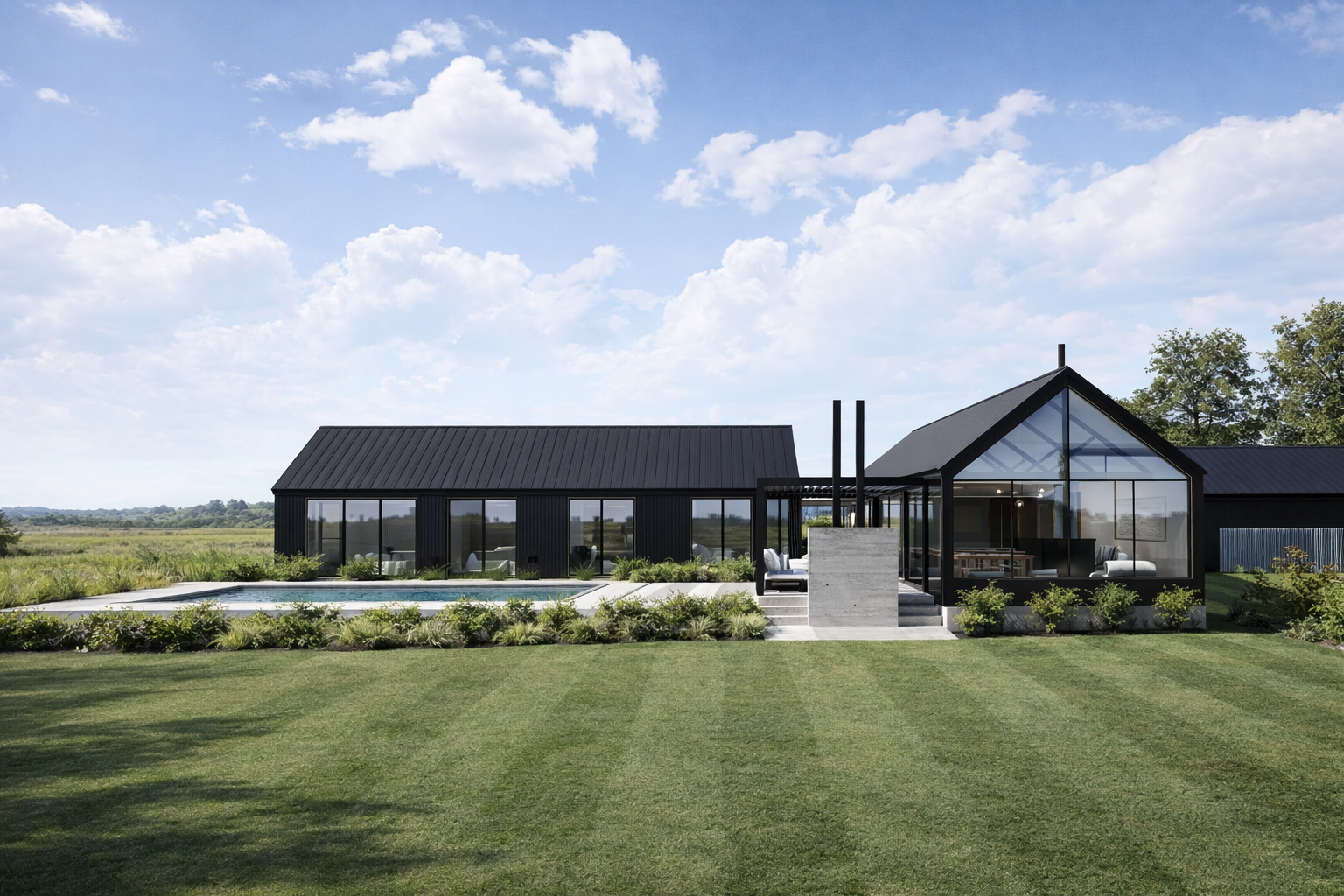Modern black house with a glass-fronted living room, surrounded by a green lawn, bushes, and a partly cloudy sky.
