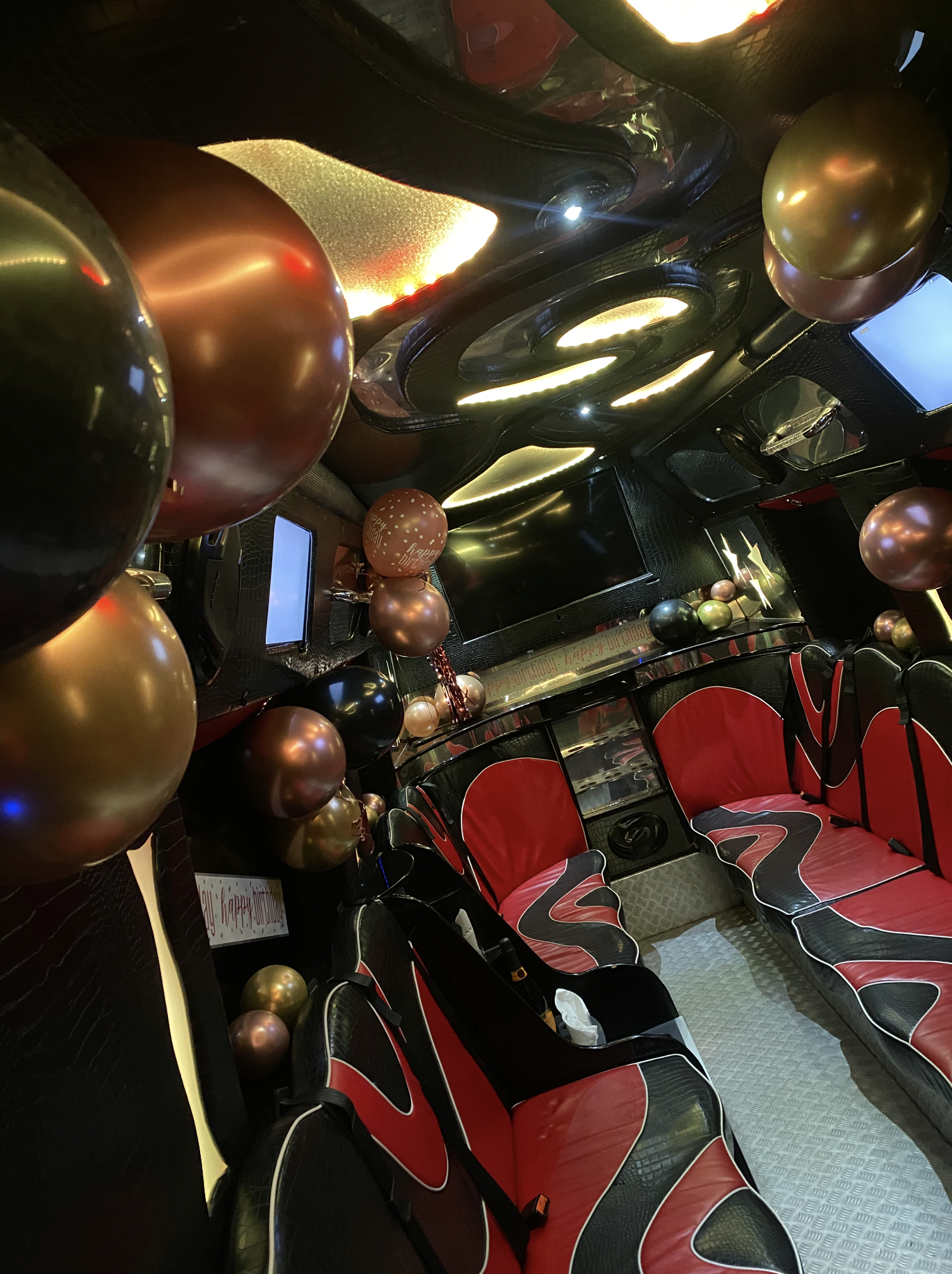 Cherry Red Glitter High Profile Party Bus Interior With Standard Balloon Decor