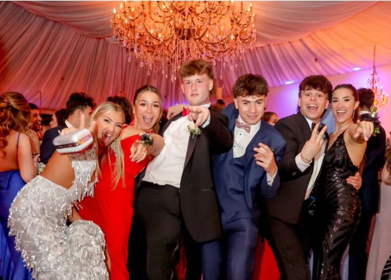 Teenagers dressed to the nines for a traditional prom photoshoot