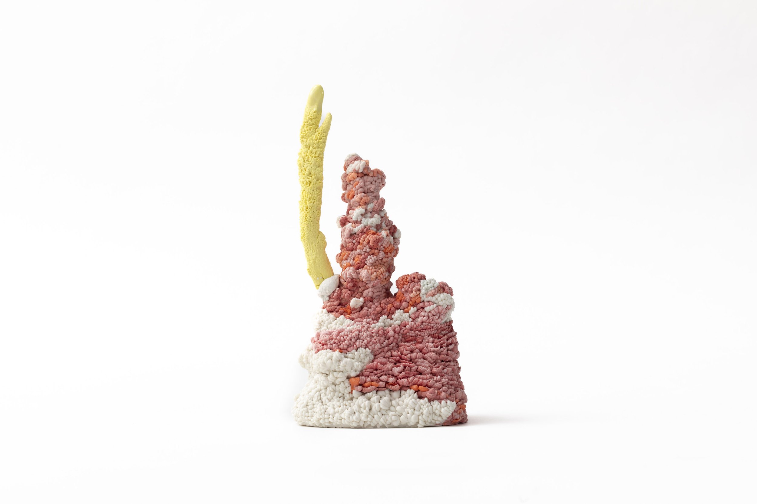 Hand built porcelain pink sculpture with a yellow stem attached on a white background.