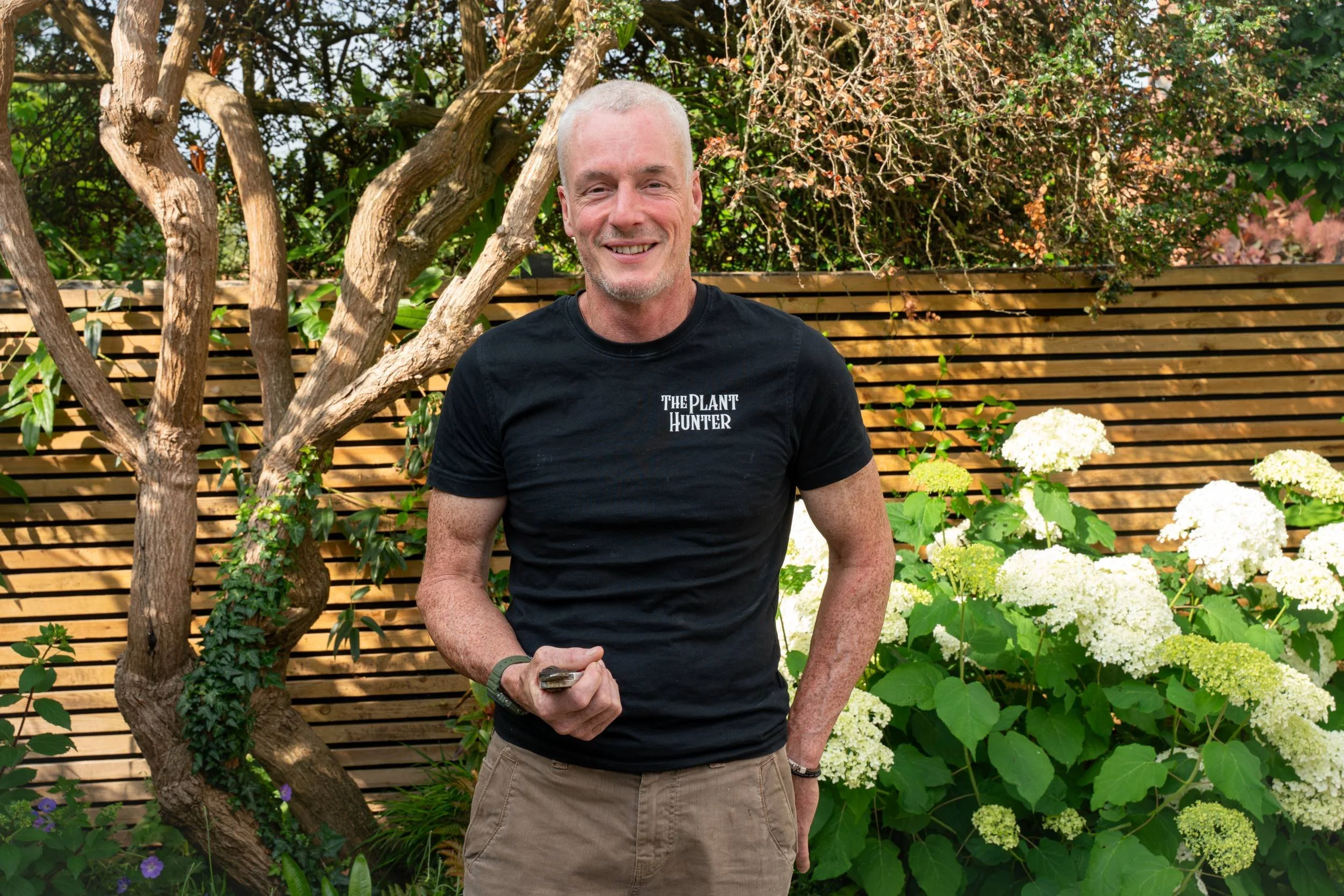 Paul Studholme, garden designer and founder of The Plant Hunter, in a Cobham garden