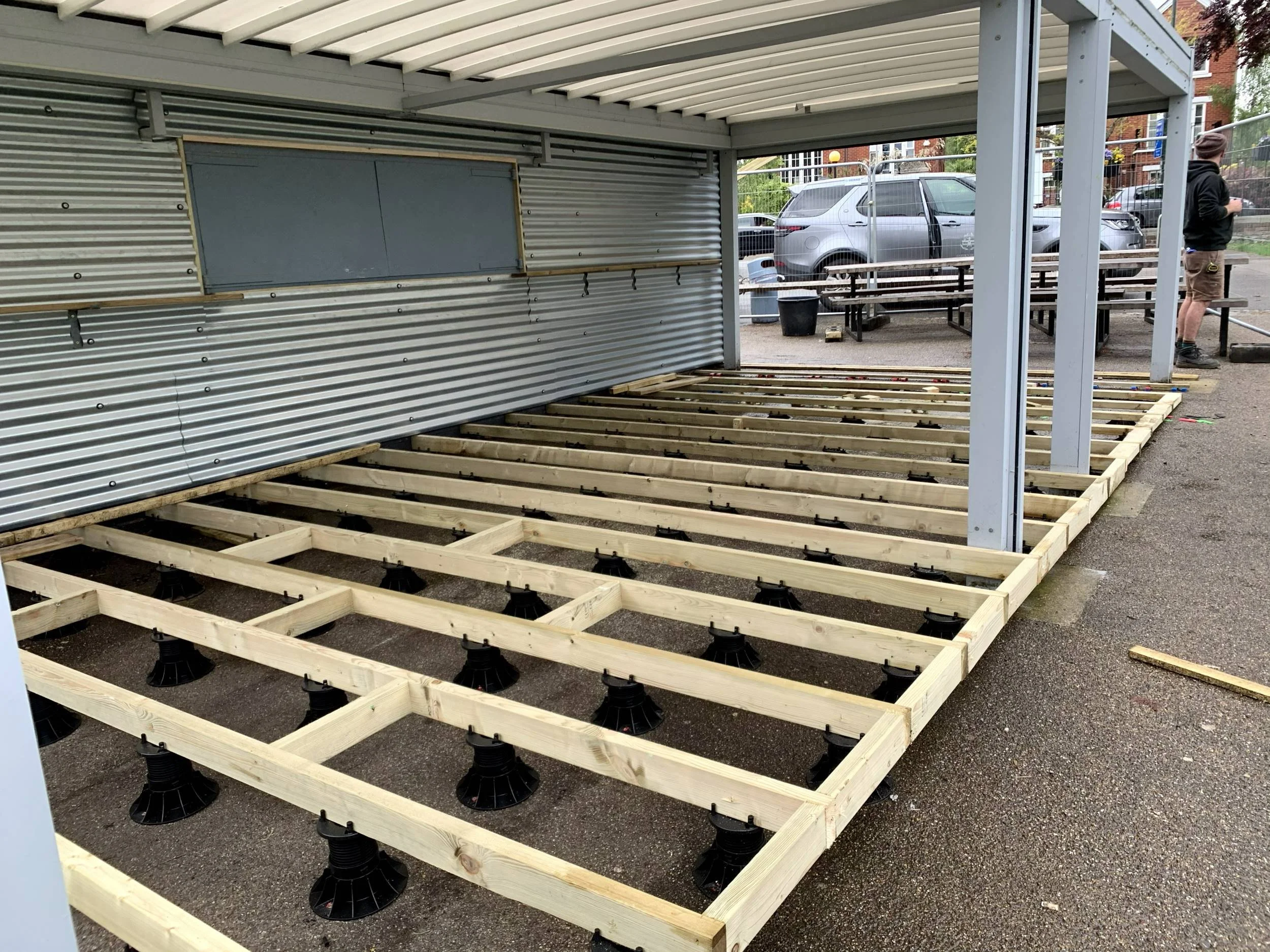 Deck joists on adjustable pedestals beside the gun emplacement at Radnor Gardens Cafe, Twickenham
