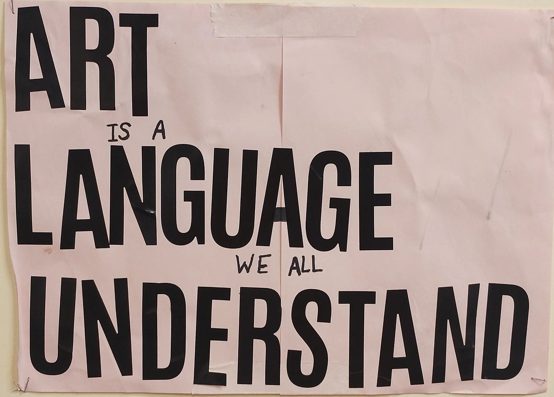 Landscape A3 paper which reads 'Art is a language we all understand' in capital letters. The words 'Art', 'Language' and 'Understand' are printed in bold, black letters.
