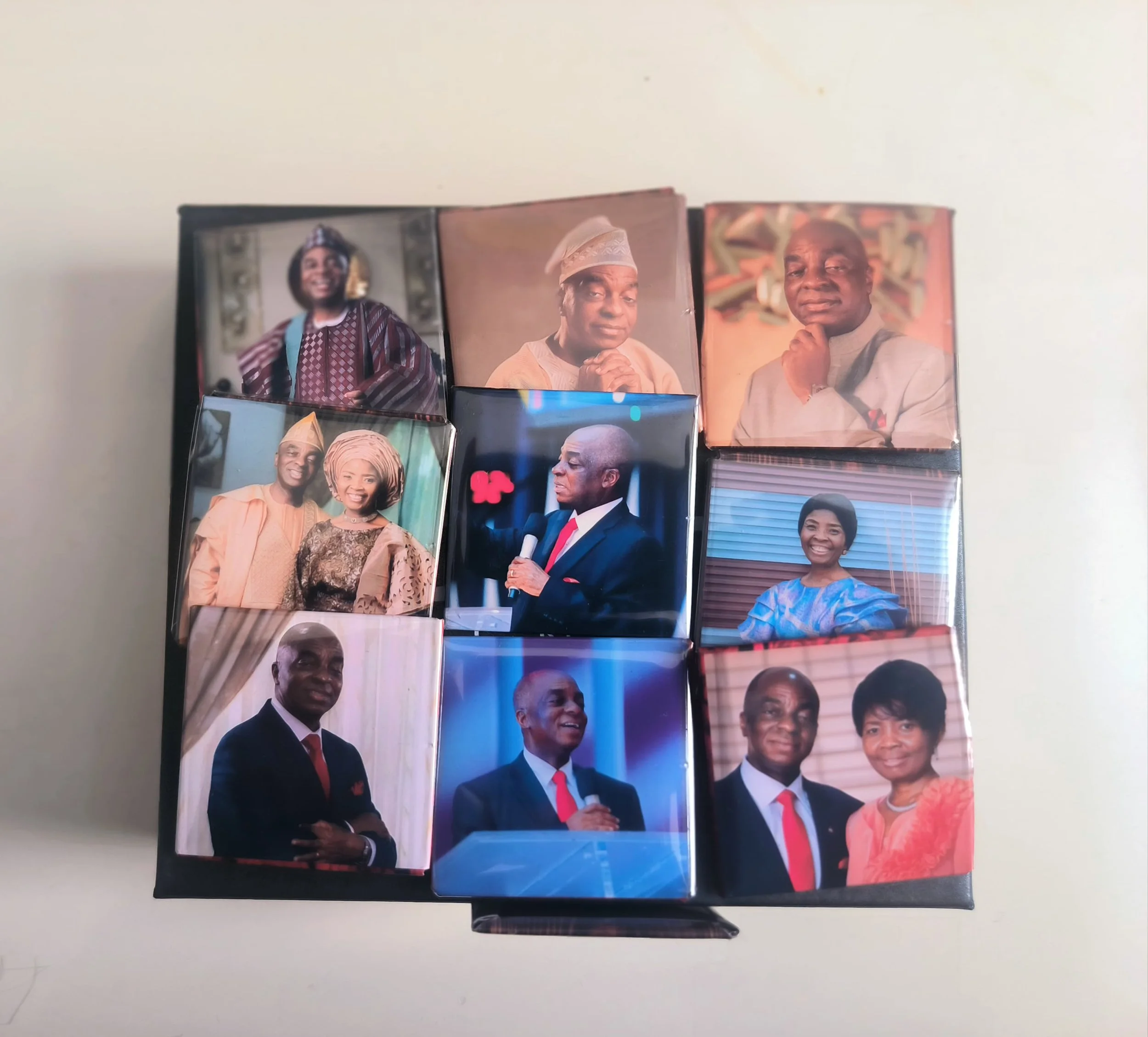 A collection of nine matchbox covers featuring various individuals in formal and traditional attire, with some posing for portraits and others speaking into microphones.